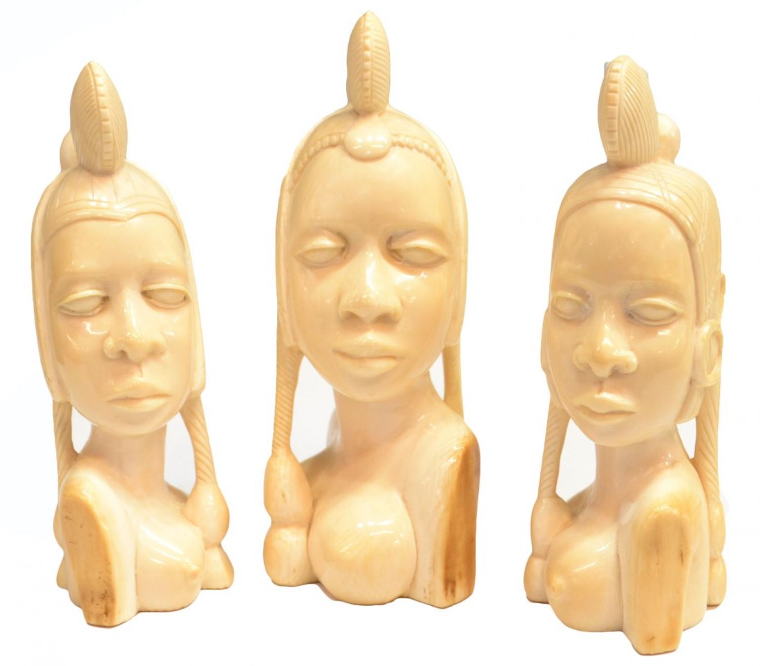 (3) AFRICAN IVORY TRIBAL BUST CARVINGS: *This lot will not be shipped internationally* (lot of 3) African ivory tribal figural busts carved as females with extravagant headdresses, overall some minor discoloration, largest: 6"h, 3"w, 2.5"d,