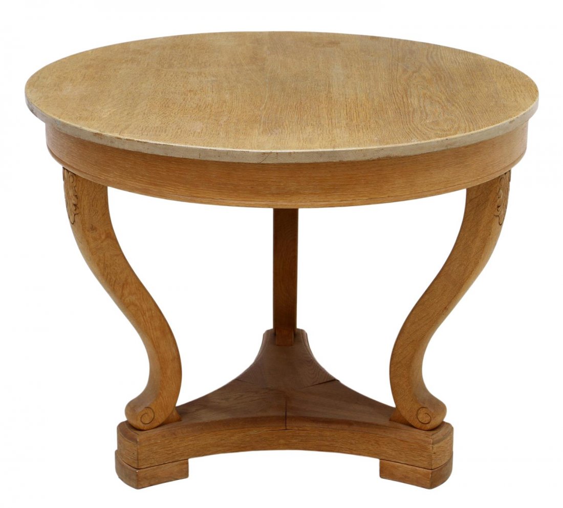 SCANDINAVIAN OAK CENTER TABLE: Scandinavian oak center table, the circular top raised on three curved legs, medial shelf on block supports, 28.5”h, 37.5”diam Start Price: $80.00