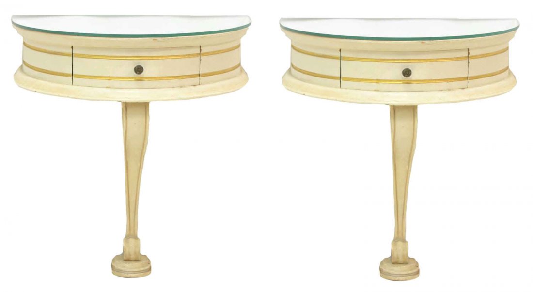 (PAIR) LOUIS XV STYLE PARCEL GILT BRACKET CONSOLES: (pair) Louis XV style bracket console tables, early 20th c., each in a painted finish with mirrored top, single curved drawer with gilt detail, rising on a scrolled support, 22"h, 19.75"w, 11.75"d Sta