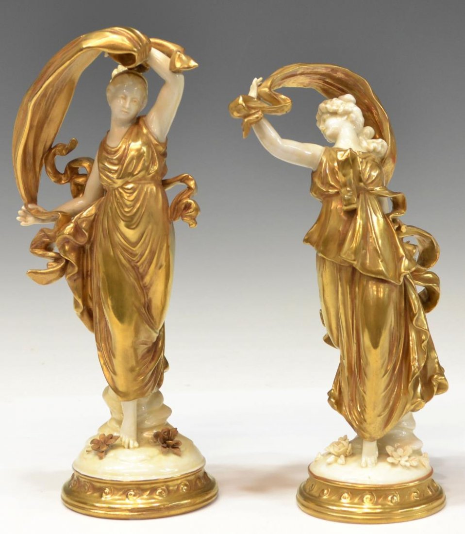 CAPODIMONTE GILDED PORCELAIN CLASSICAL BEAUTIES: (pair) Capodimonte porcelain figures, modeled as classical maidens in heavily gilded flowing gowns, bases with applied flowers, varied blue crown over 'N' marks as pictured, one with loss to fingers,