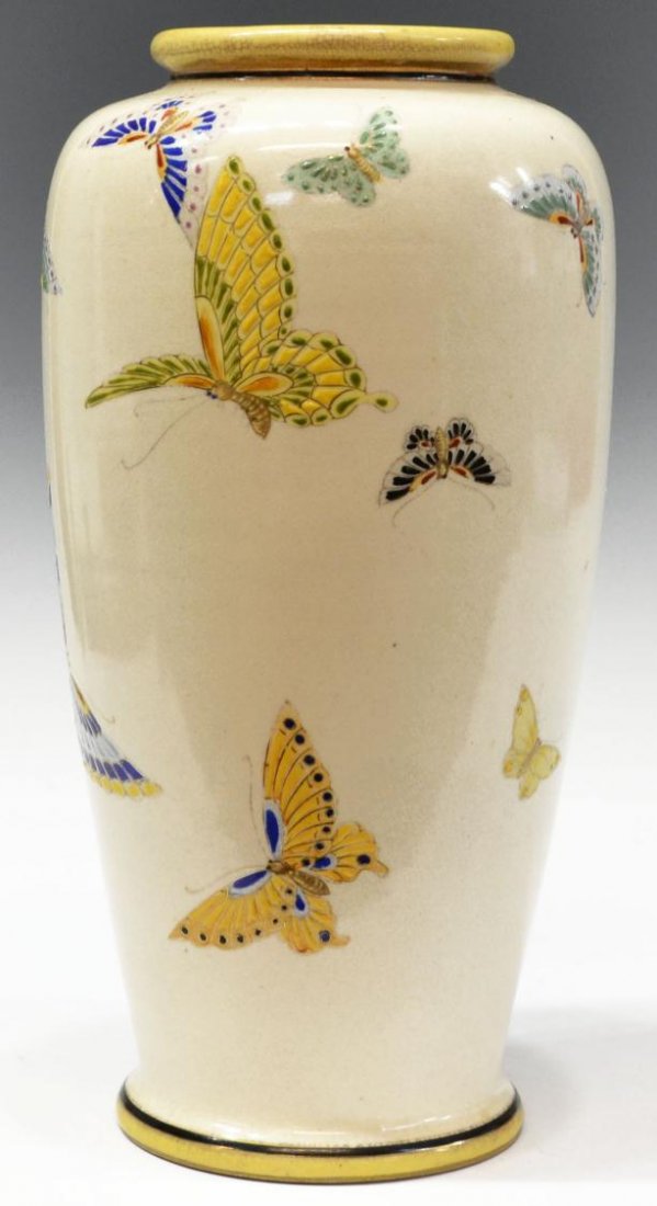 NIPPON BALUSTER FORM POLYCHROME BUTTERFLY VASE: Nippon vase of baluster form, 20th c., polychrome butterflies on a cream ground, green wreath mark, impressed 'Japan' underfoot, some crazing and paint loss, 10.5"h, 2.5lbs Start Price: $50.00