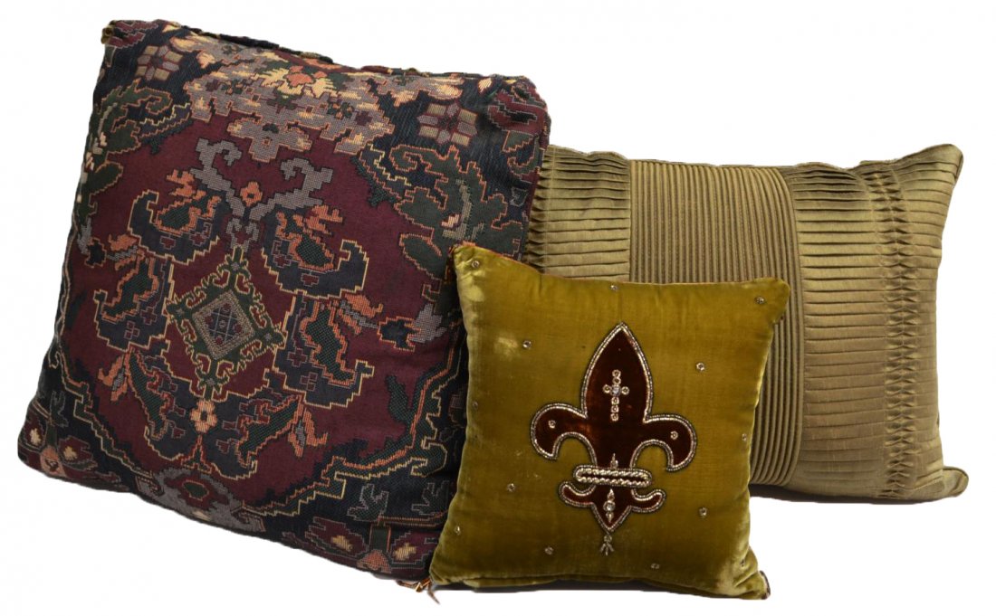 (3) Decorative Throw Pillows: (lot of 3) Collection of various decorative throw pillows, comprising: (1) small velvet-like square pillow, embellished with a fleur-de-lis, 9.5"h, 9.5"w; (1) rectangular gold 'Capris Pleat Oblong' de