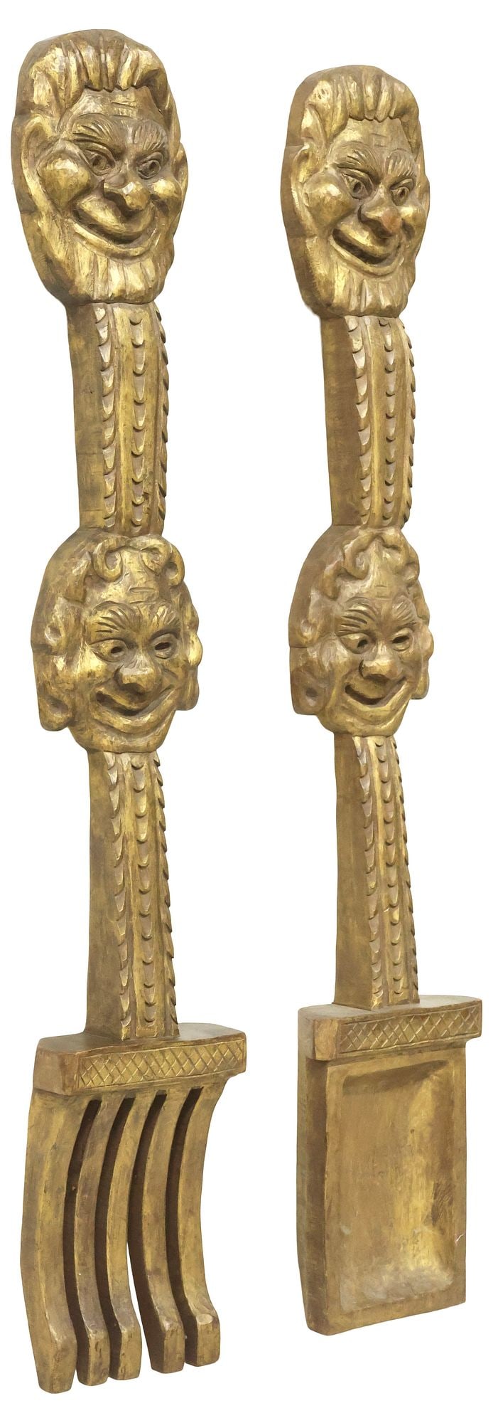 (2) FIGURAL GILT-PAINTED WALL SCULPTURES, OVERSIZED FORK & SPOON, 51"L: (lot of 2) Large gilt-painted carved wood figural wall ornaments, each in the form of oversized flatware, with figural grotesque masks and foliate motifs, slightly varied sizes, largest: approx 51"l,
