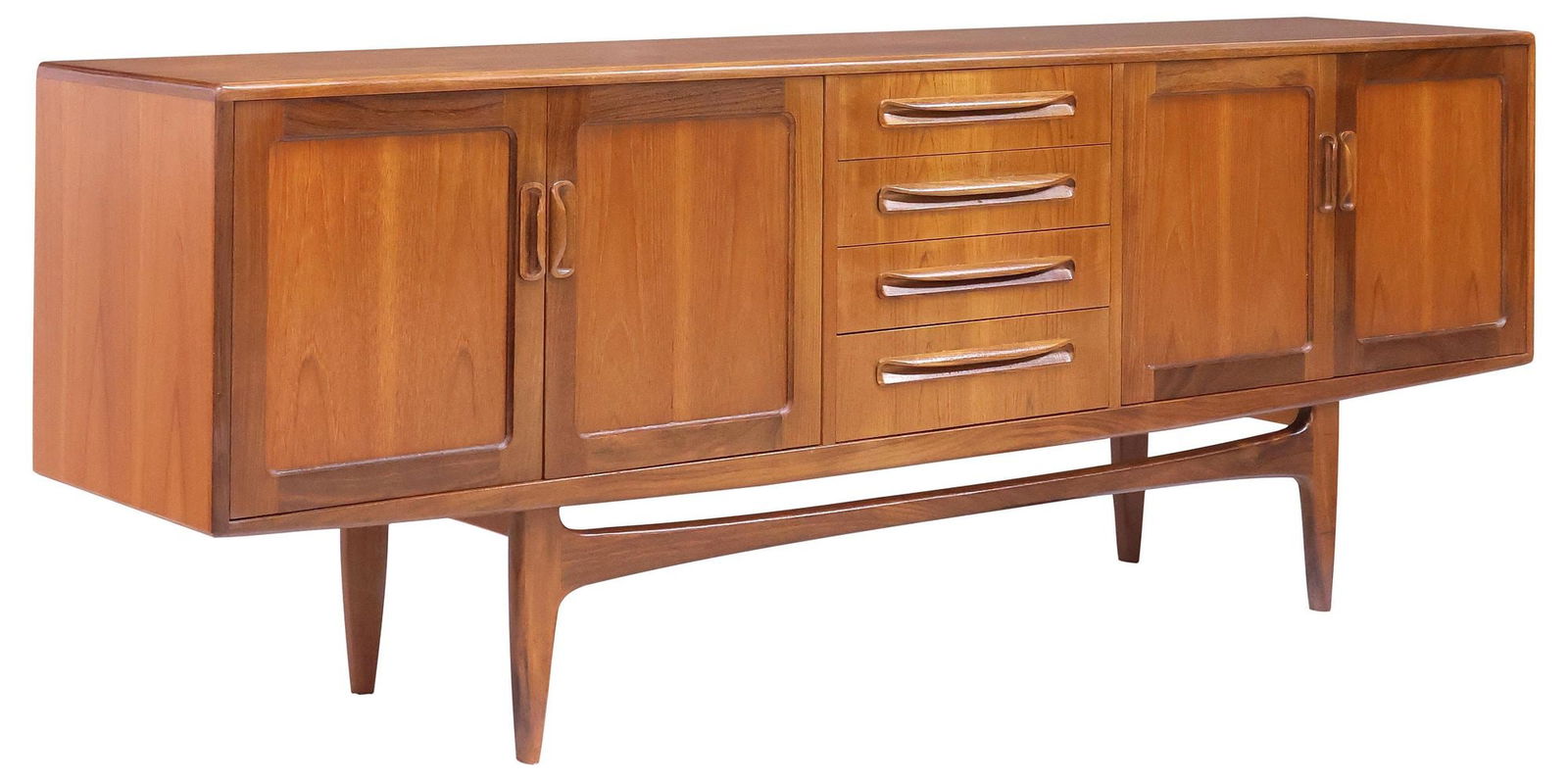 G PLAN 'FRESCO' MID-CENTURY MODERN TEAK SIDEBOARD: Mid-century modern teak credenza/ sideboard, Victor B. Wilkins for G Plan, c.1960s, having four centered drawers, the top drawer with divided interior, flanked at sides by dual cabinet doors, enclosin