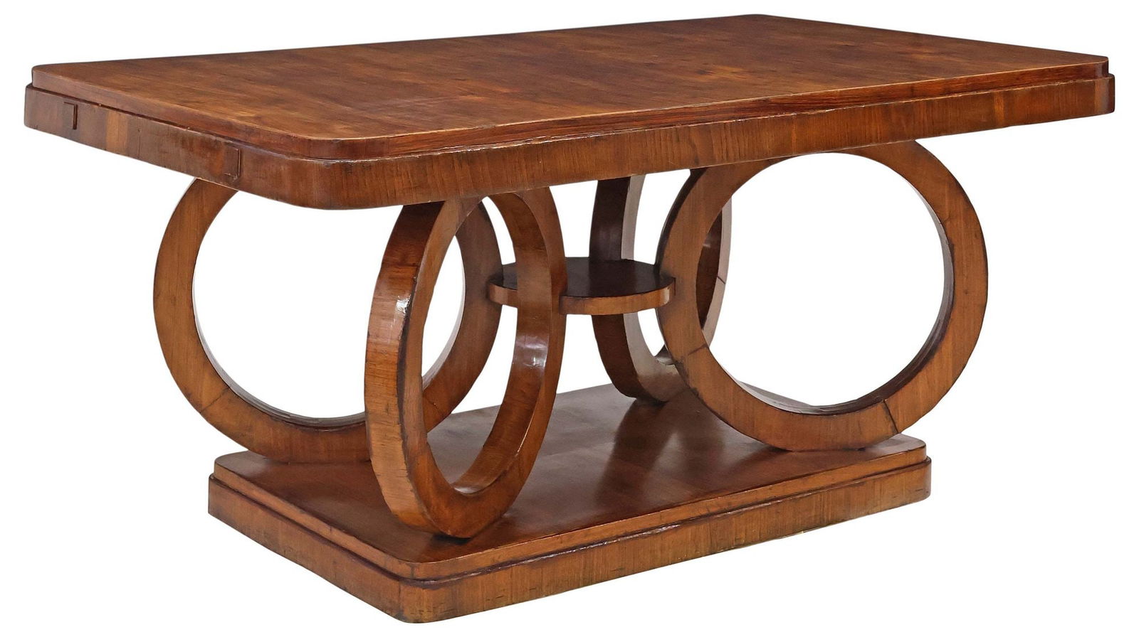 FRENCH ART DECO STYLE SCULPTURAL RINGS WALNUT DINING TABLE: French Art Deco style walnut dining table, 20th c., having rounded rectangular top, rising on sculptural ring-form supports, ending on platform base, approx 31.25"h, 69"w, 39"d, floor to bottom of apr