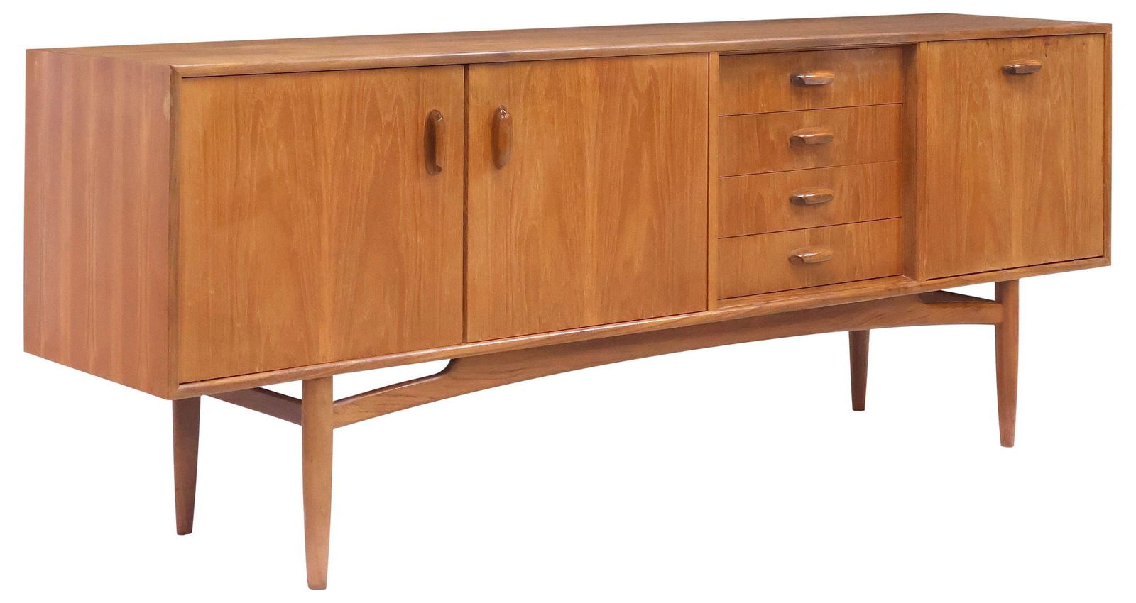 G PLAN 'FRESCO' MID-CENTURY MODERN TEAK CREDENZA SIDEBOARD: Mid-century modern teak credenza/ sideboard, Victor B. Wilkins for G Plan, c.1960s, having four centered drawers, flanked by single drop-front cabinet with open interior, and a pair of cabinet doors,