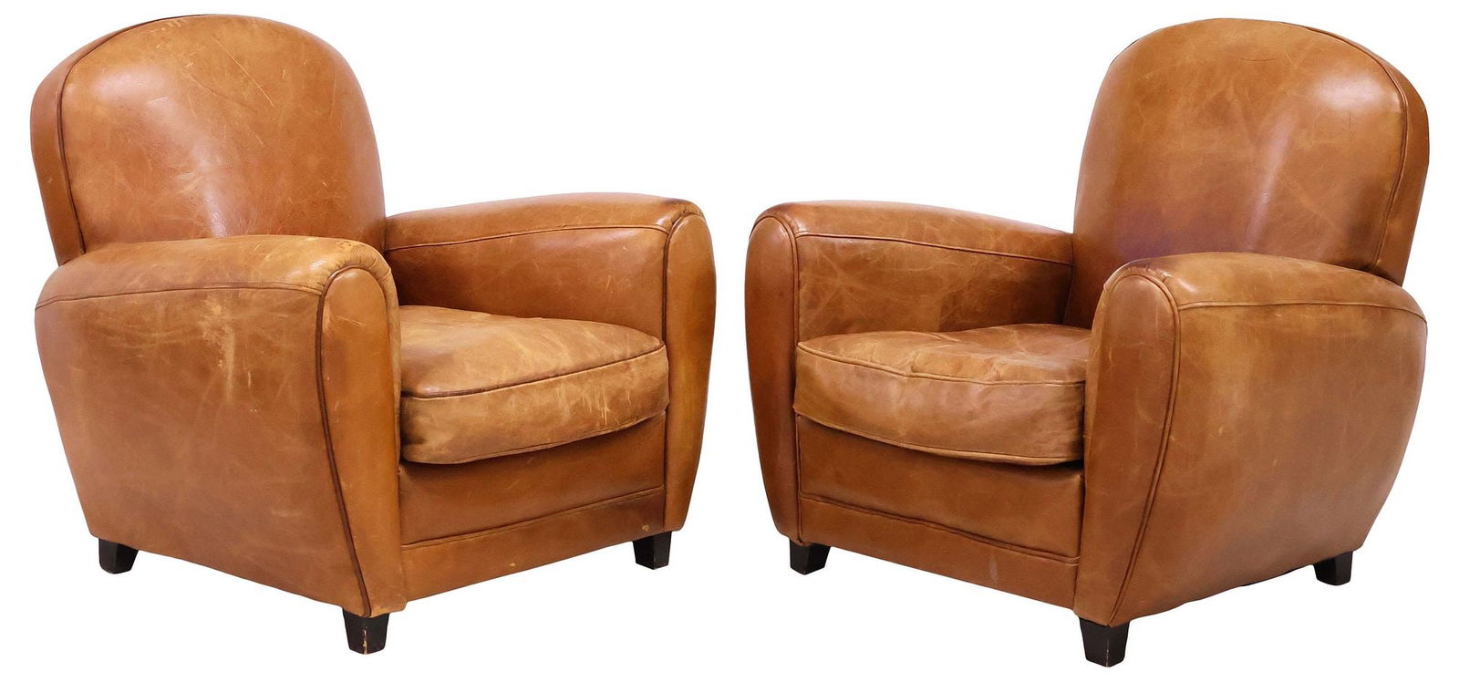(2) FRENCH ART DECO PERIOD TAN LEATHER CLUB CHAIRS: (pair) French Art Deco period club armchairs, c.1930s, each in worn tan leather upholstery, having rolled seat back and arms, with removable seat cushion, rising on wood block feet, approx 32"h,