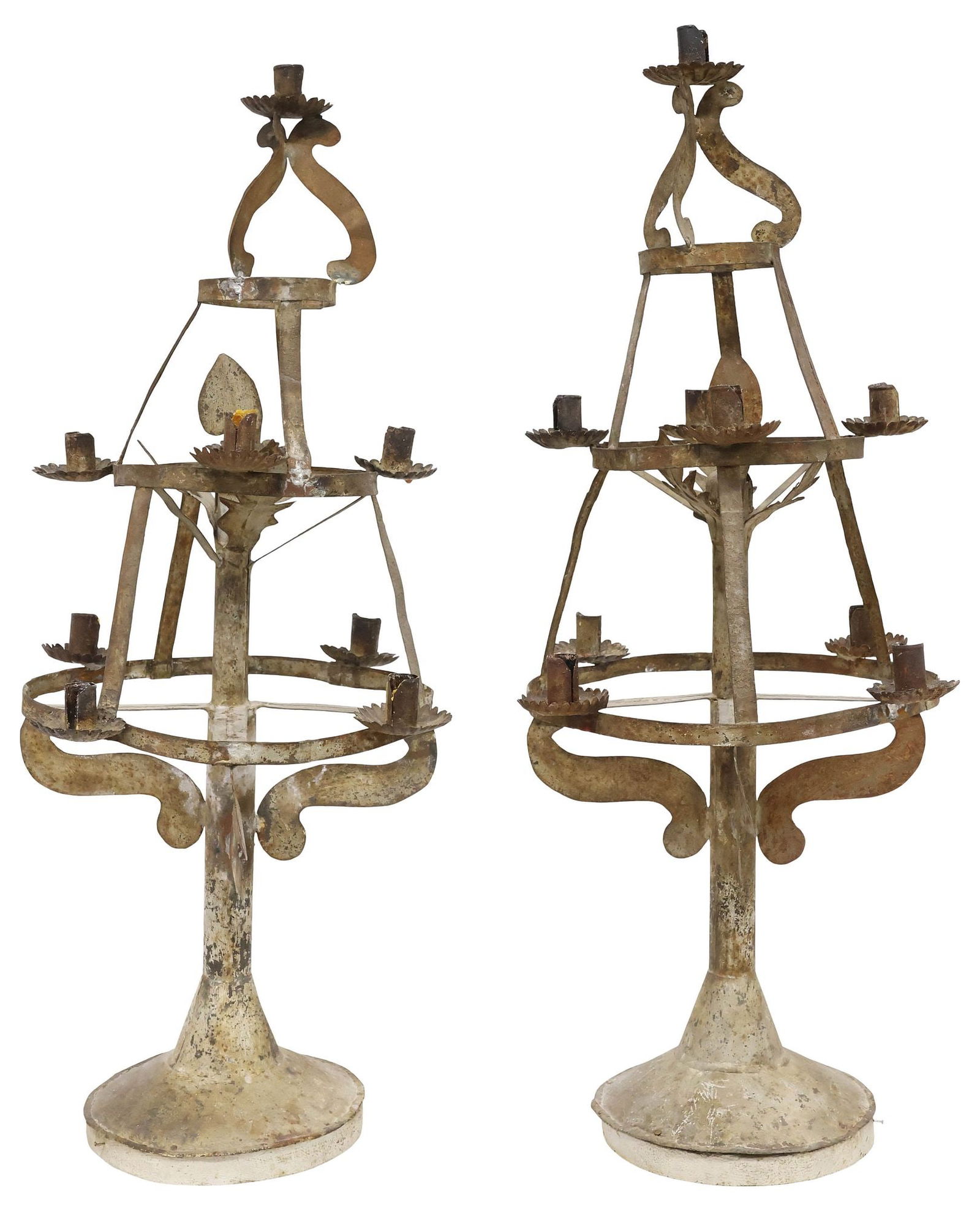 (2) SPANISH COLONIAL STYLE TIERED TIN 9-LIGHT CANDELABRAS, 33"H: (pair) Spanish Colonial style tin nine-light candelabra/ votive candle stands, 19th c., each having scalloped bobeches, on tiered circular stand, rising on round base, (one) with uppermost arm detache
