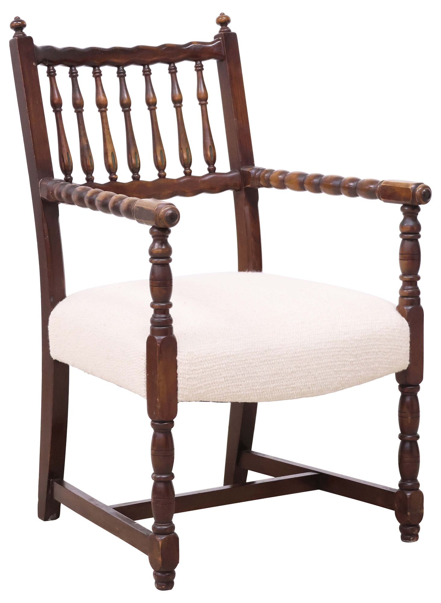 ENGLISH BOBBIN-TURNED WALNUT UPHOLSTERED ARMCHAIR: English walnut armchair, 20th c., having scalloped top rail and spindle back, flanked by finials, with bobbin-turned arms, over woven upholstered seat, rising on turned supports joined by