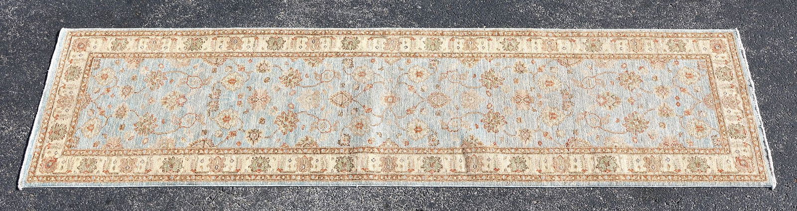 ESTATE HAND-TIED PESHAWAR WOOL RUNNER, 9'9" X 2'8": Estate hand-tied wool pile Peshawar runner, Pakistan, retailed by Jewel Rugs, approx 9'8"l, 2'8"w **Please Note: All of the rugs offered in this auction would likely benefit from a professional
