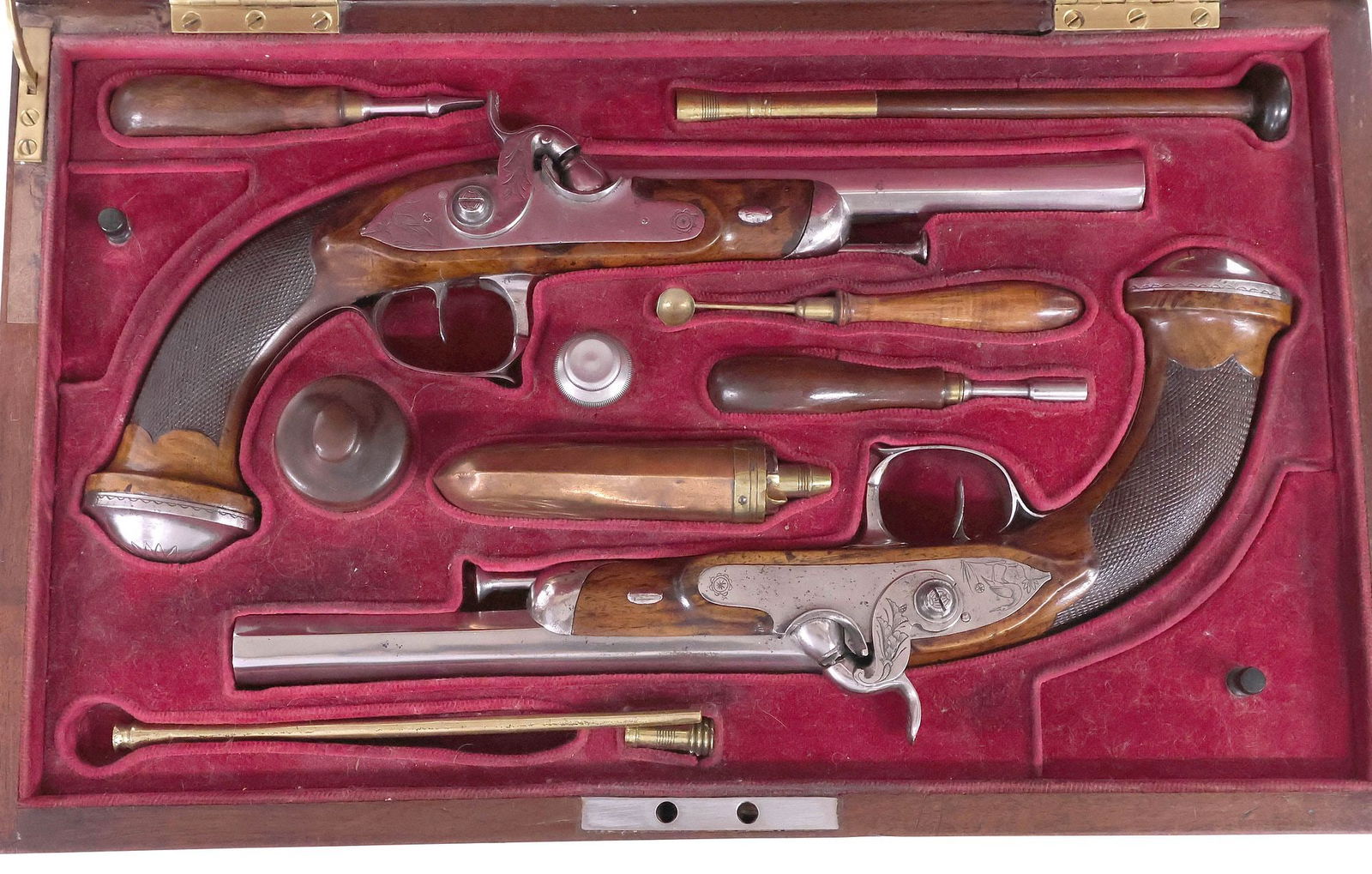 CASED MATCHED PAIR PERCUSSION PISTOLS, MID 19TH CENTURY: Cased Matched Pair of Percussion Pistols, Spain or French origin, mid 19th century, approx. .48-50 caliber, the metal appearing as silver or nickel plate, the 7" octagonal smoothbore barrels slightly