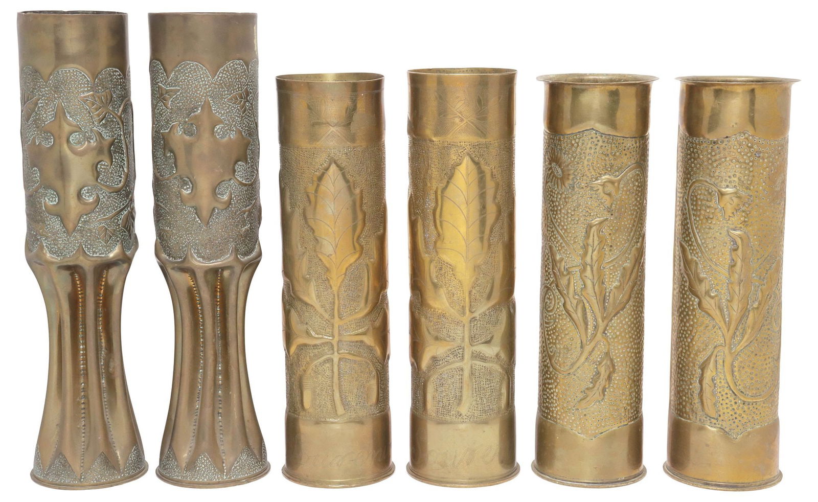 (6) FRENCH WWI-ERA TRENCH ART ARTILLERY SHELL VASES: (lot of 6) French WWI-era trench art vases, fashioned from artillery shells, including: (pair) having repousse foliate motifs, rising on waisted stem, (pair) decorated with raised branch on textured g