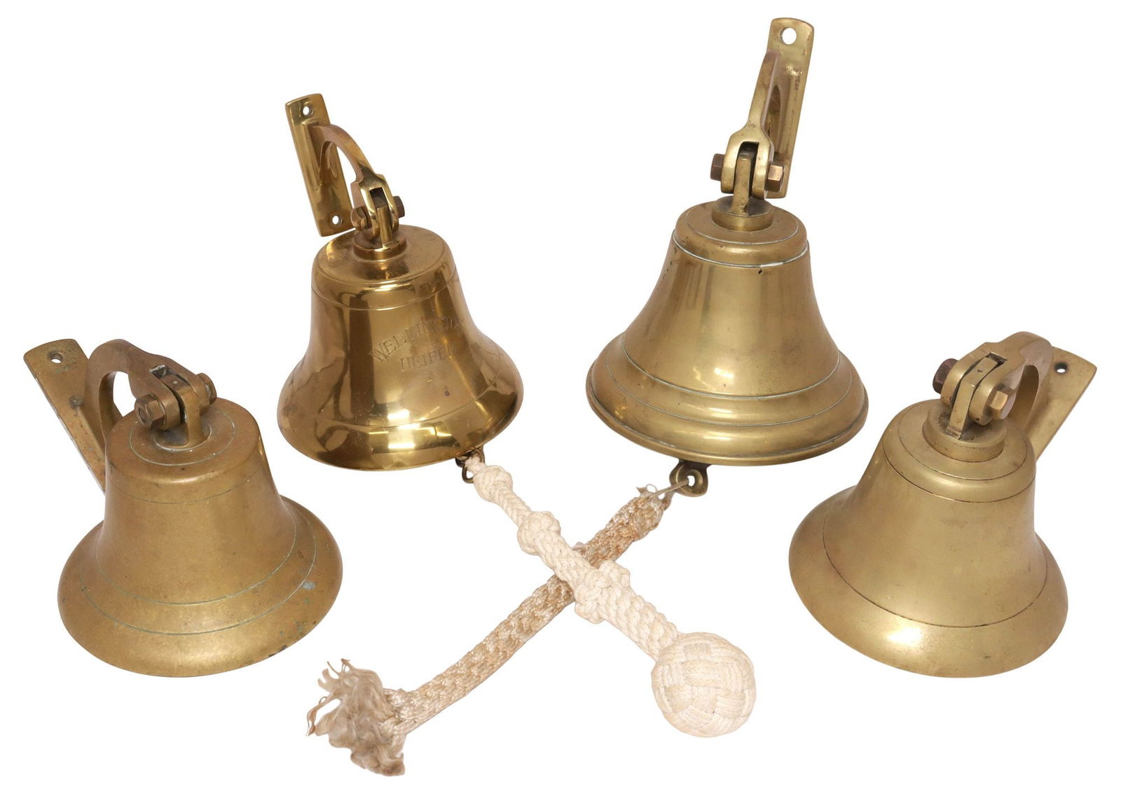 (4) PATINATED METAL WALL-MOUNTED BELLS, ONE ENGRAVED: (lot of 4) Patinated metal bells, possibly bronze, early 20th c., each having wall mounting bracket and clapper, one engraved "Wellington Heifer," largest: approx 8.5"h, 6.75"w, 8.5"d, 18lbs total