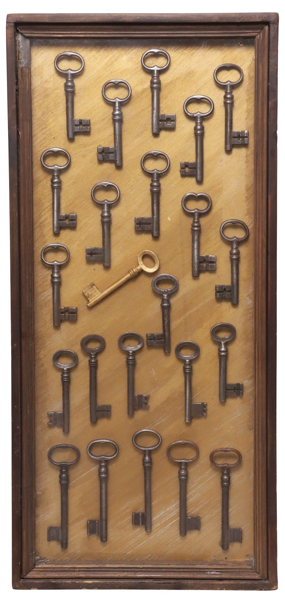 (23) ANTIQUE KEY COLLECTION DISPLAYED IN SHADOW BOX: Antique key collection housed under glass in a wood-framed shadow box, 23 keys all appearing as 19th c., for shipping shadow box approx. 2" x 22.5" x 10.5", 8.80lbs
