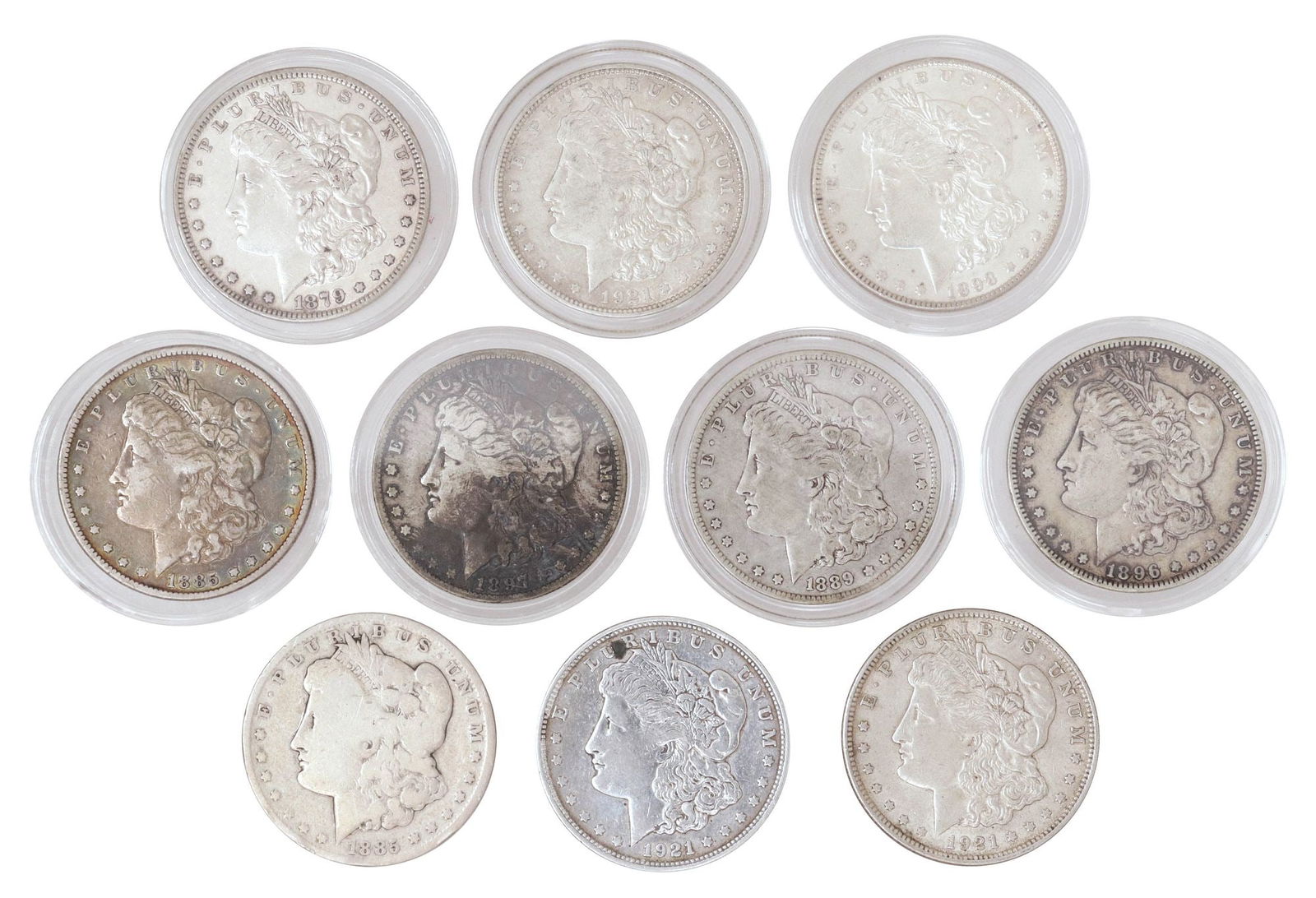 (10) U.S. MORGAN SILVER DOLLARS: (10) U.S. Morgan Silver Dollars: (1) 1879-P; (1) 1885-P; (1) 1885-O; (1) 1889-O; (1) 1896-P; (1) 1897-O; (1) 1898-P; (1) 1921-P; (2) 1921-D **NOTE: ALL JEWELRY & COIN LOTS REALIZING OVER $1,000 MUST B
