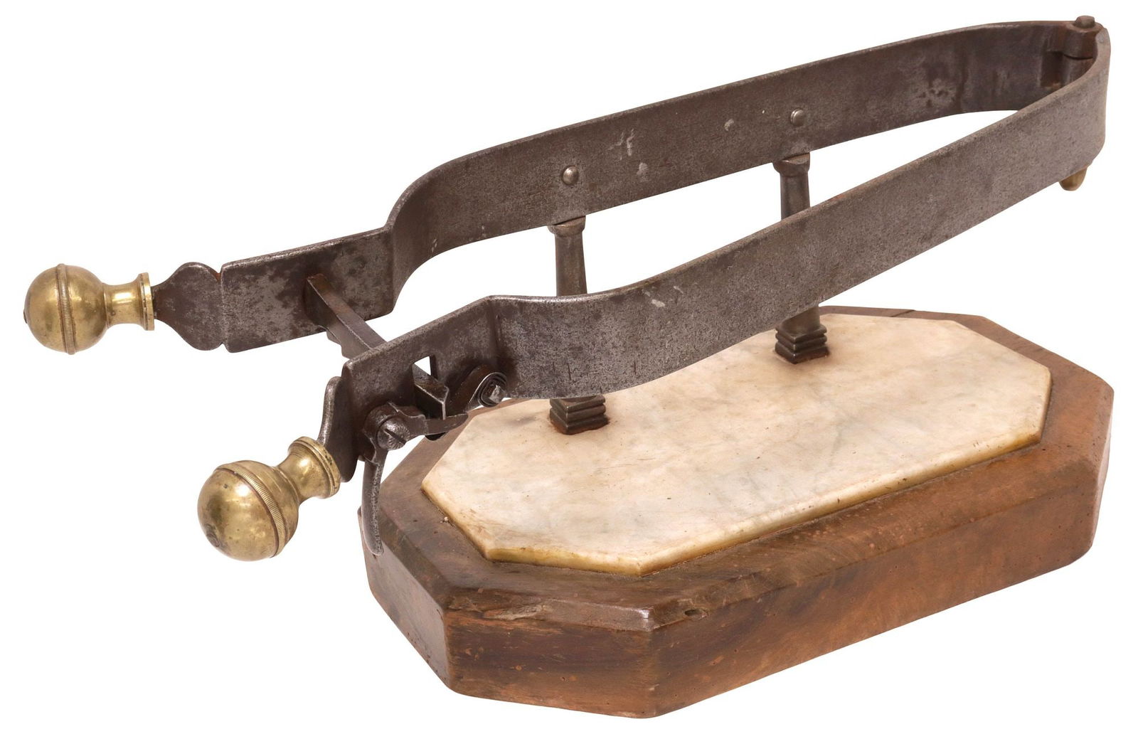 IRON & BRASS 'PORTE JAMBON' MEAT CARVING STAND ON MARBLE-INSET BASE: Patinated iron and gilt-brass porte-jambon or ham carving stand, 19th c., having arched frame with center tooth joint, rising on marble-topped octagonal wood base, approx 8.75"h, 20.5"w, 9.25"d, 18.5l