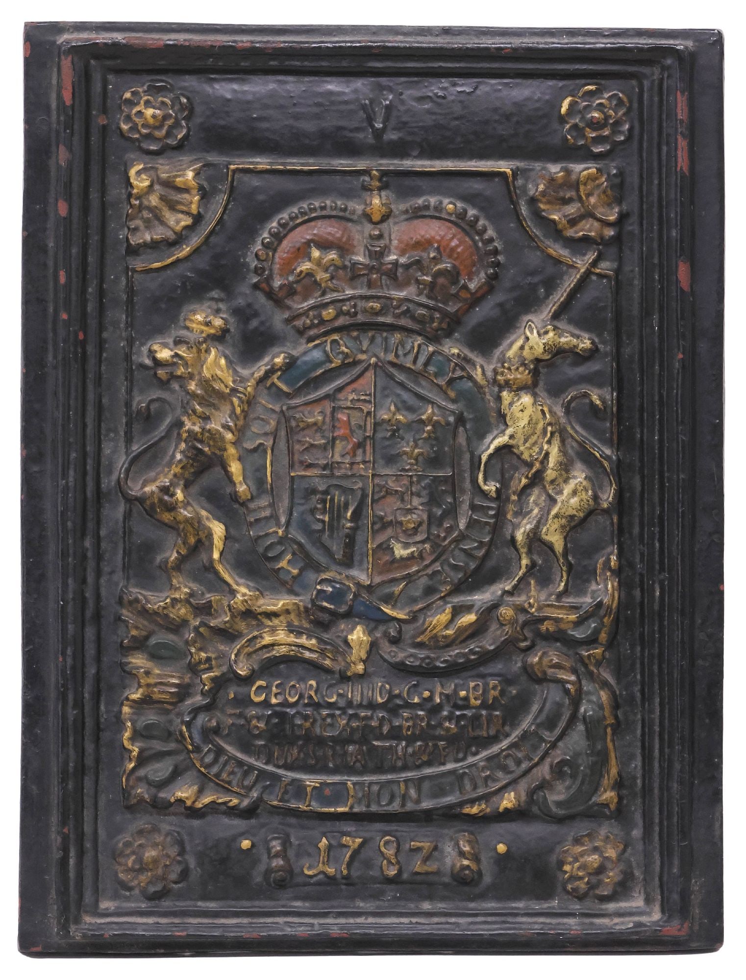 ENGLISH VICTORIAN ARMORIAL CAST IRON FIRE BACK PANEL / FIREPLACE PLAQUE: English Victorian cast iron fireplace plaque or fire back panel, late 19th c., depicting the royal coat of arms of the United Kingdom, in a worn polychrome-painted finish, approx 22.25"h, 16.75"w,