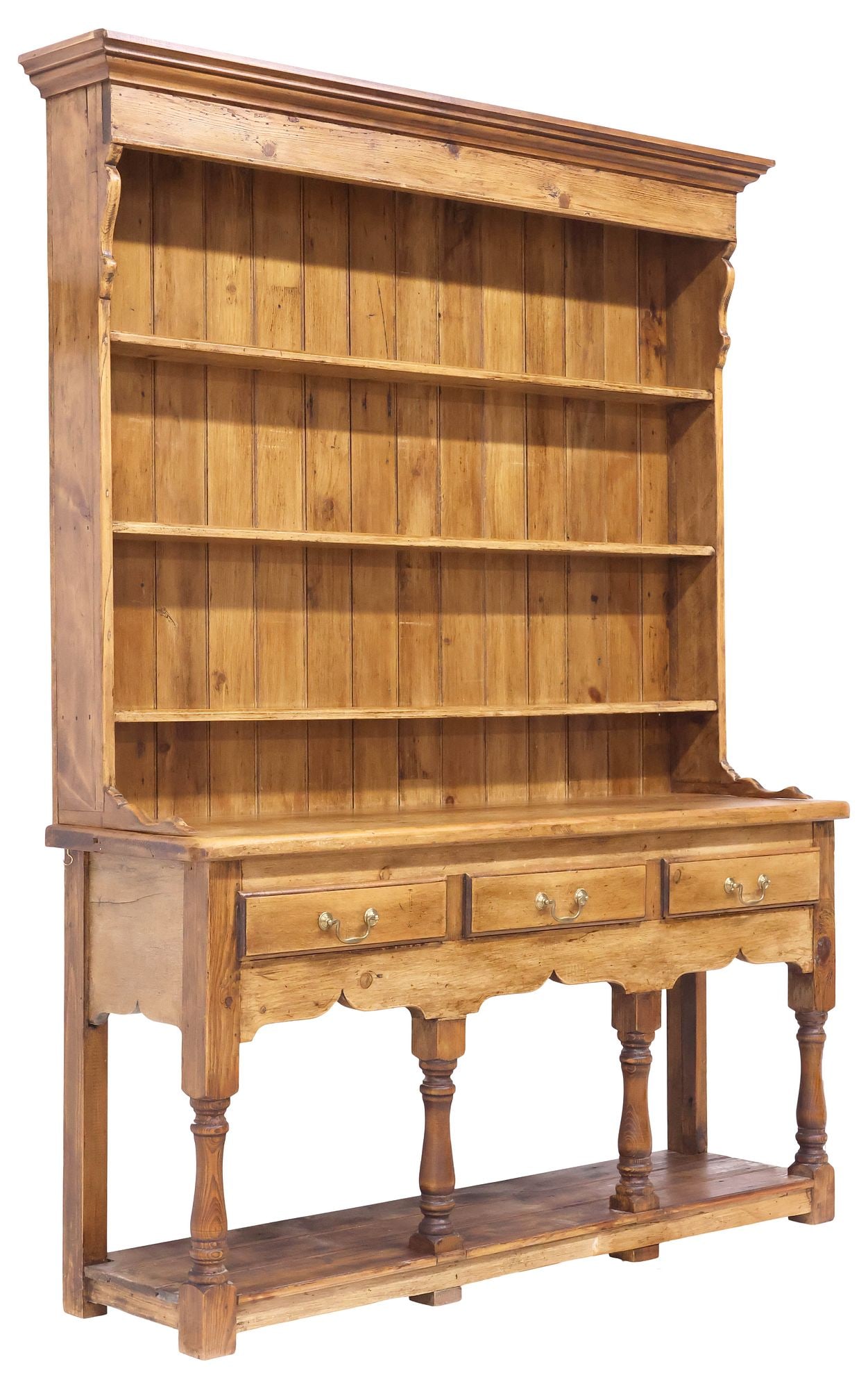 ENGLISH VICTORIAN PINE KITCHEN DRESSER: English Victorian pine kitchen dresser, late 19th c., topped by molded cornice, over large plate rack with three fixed-height shelves with plate grooves, lower case with three drawers, rising on