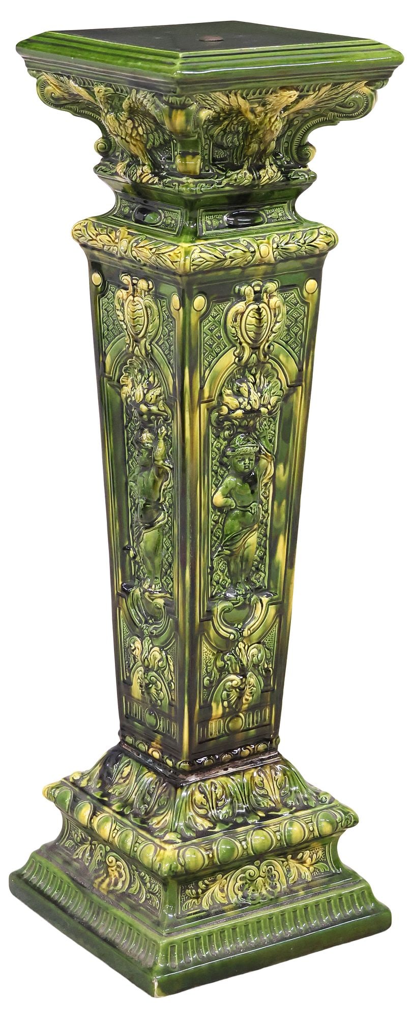 ENGLISH GREEN GLAZED MAJOLICA DISPLAY PEDESTAL / PLANT STAND: English tin-glazed majolica pedestal/ plant stand, early 20th c., in an all-over green and yellow glaze, having stepped square top, raised on the outstretched wings of eagles, above tapered standard w