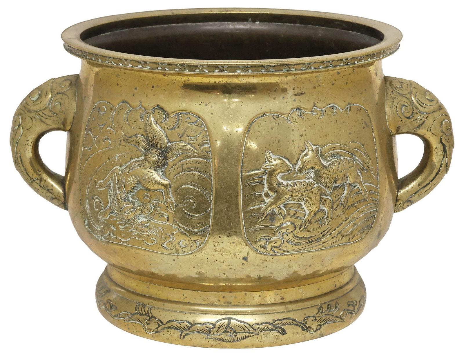 CHINESE BRASS REPOUSSE HANDLED JARDINIERE / PLANTER: Chinese brass jardiniere/ planter, having flared rim over dual elephant mask handles, repousse reserves depicting mythical deer and qilin, among foliates and cloud scrollwork, rising on circular