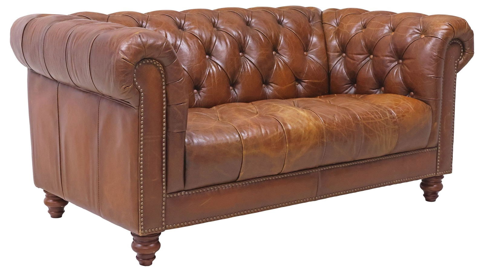 ENGLISH BROWN BUTTONED-LEATHER 2-SEAT CHESTERFIELD SOFA: English Chesterfield style two-seat sofa, late 20th c., in a button-tufted light brown leather upholstery, with nail-head trim, rising on turned wood feet, approx 32.5"h, 67"w, 38.5"d, seat height: ap