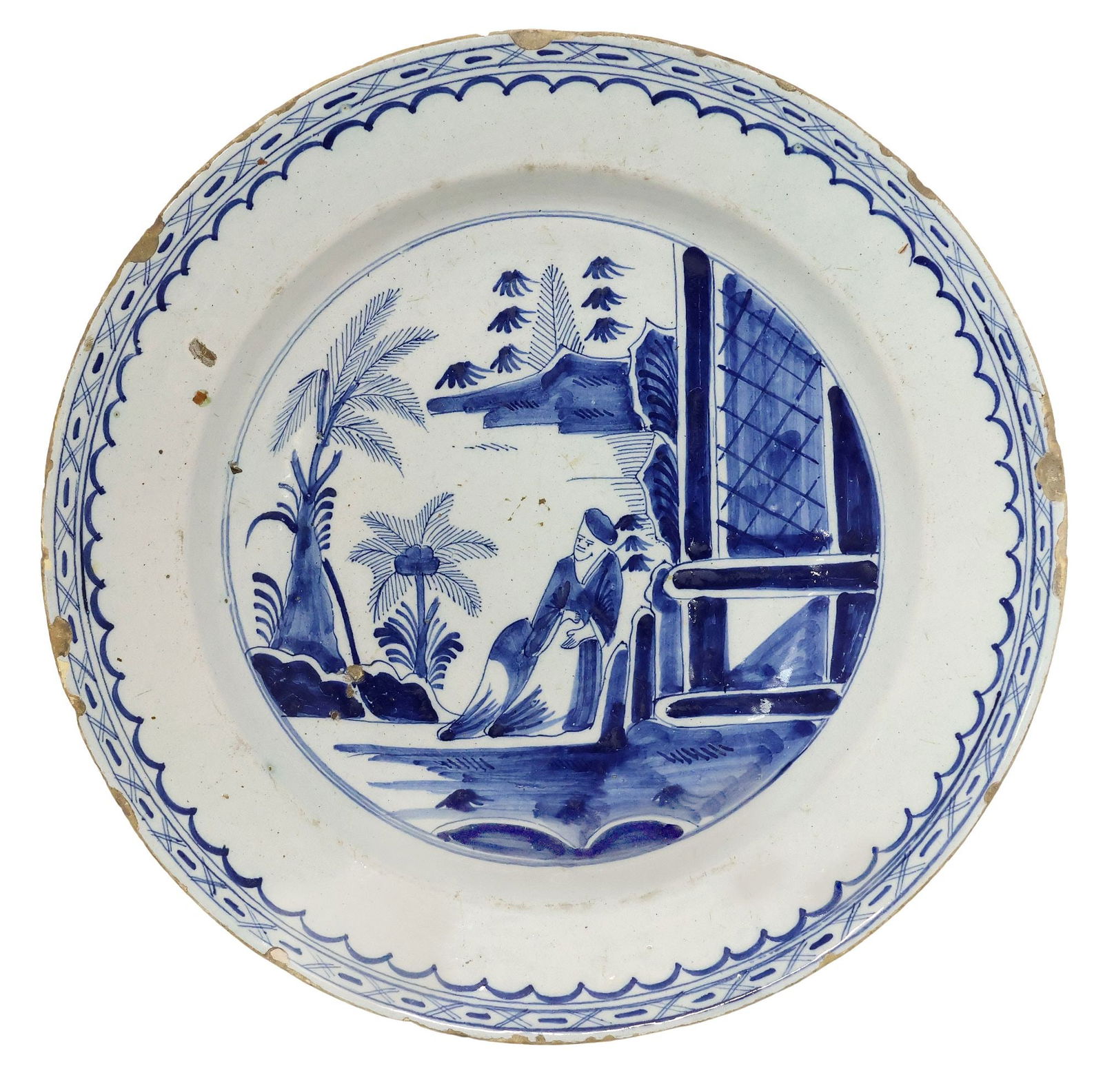 DELFT CHINOISERIE BLUE & WHITE CHARGER, 18TH C.: Delft blue and white tin-glazed earthenware charger, late 18th c., depicting a seated male figure in chinoiserie landscape, with scalloped geometric trim, approx 13.5"diam, 3.5lbs **Provenance: from t