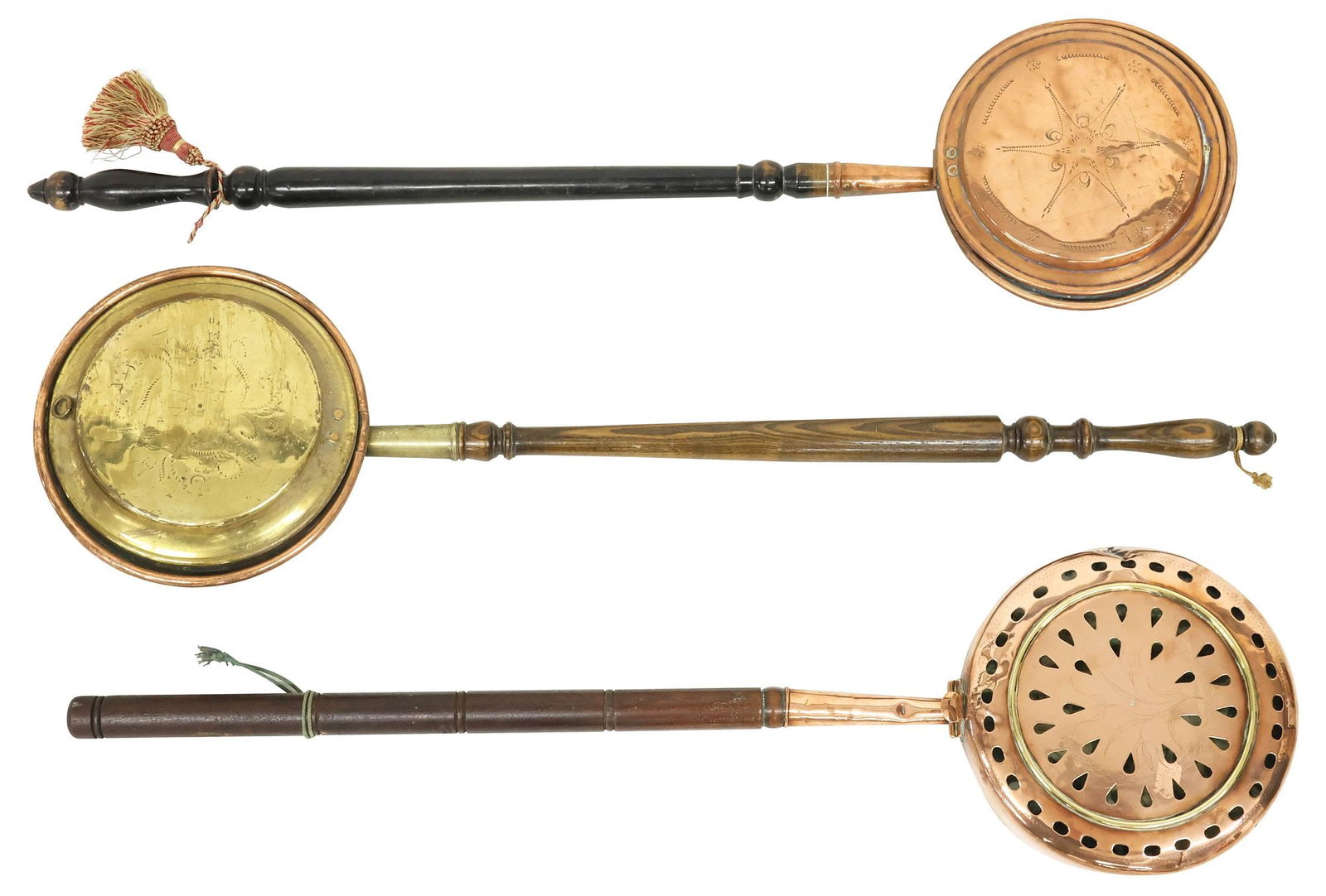 (3) VICTORIAN COPPER & BRASS BED WARMING PANS: (lot of 3) Victorian brass and copper bed warmers, late 19th/ early 20th c., each pan with stamped floral and geometric motifs, long turned wood handle, typical denting throughout, (one) with pierced
