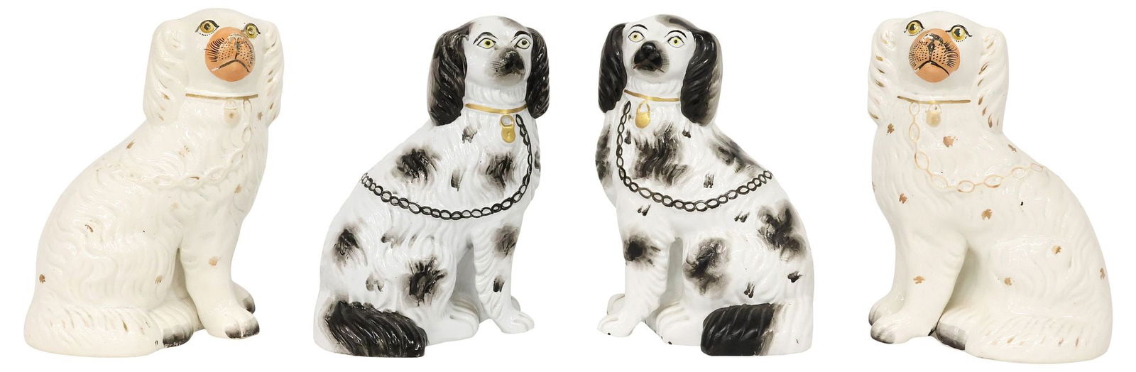 (4) ENGLISH STAFFORDSHIRE MANTEL DOGS, IN TWO PAIRS: (lot of 4) English Staffordshire mantel dogs, 20th c., comprising two pairs, each modeled as a seated spaniel, with painted features, and remnants of gilt decoration, including: (2) with black-painted