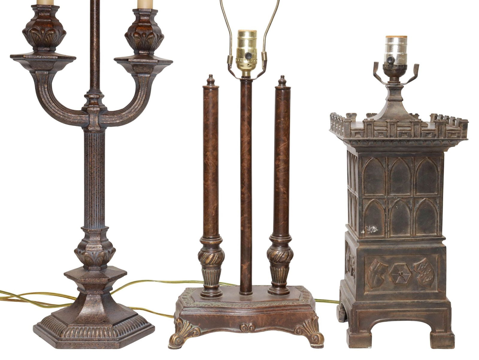 (3) CONTEMPORARY METAL 1-LIGHT TABLE LAMPS, 1 IN FORM OF CASTLE TURRET: (lot of 3) Contemporary metal one-light table lamps, 20th/ 21st c., each observed operating, including: (1) patinated turret-form lamp, crenellated top, over molded arched window and armorial crest mo