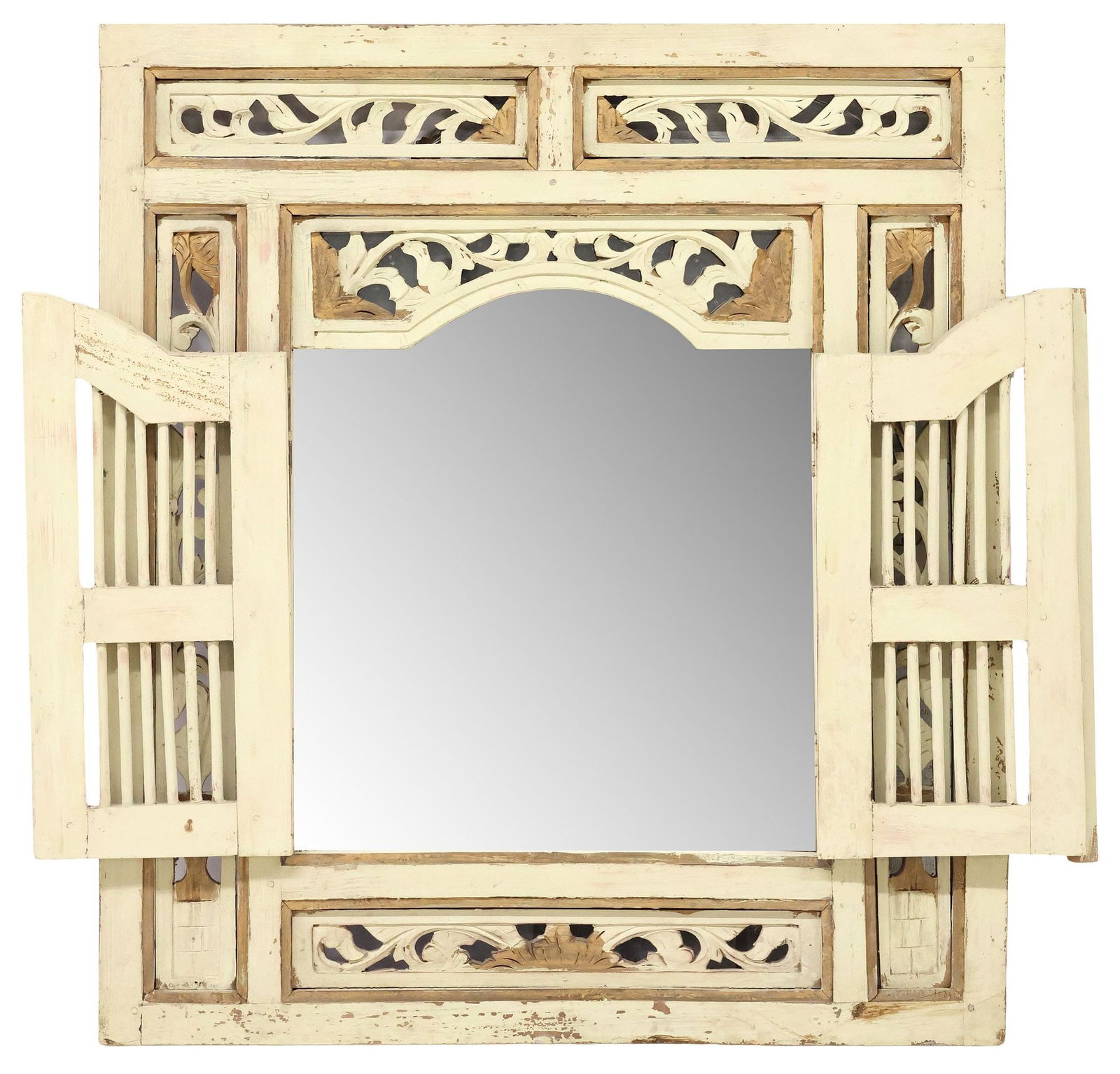 INDONESIAN CARVED & PAINTED ARCHITECTURAL WINDOW FRAME WALL MIRROR: Hand-carved hardwood architectural window-form wall mirror, Indonesia, pierced rectangular frame with running foliate ornamentation, centering dual hinged and spindled doors, revealing flat mirror pla