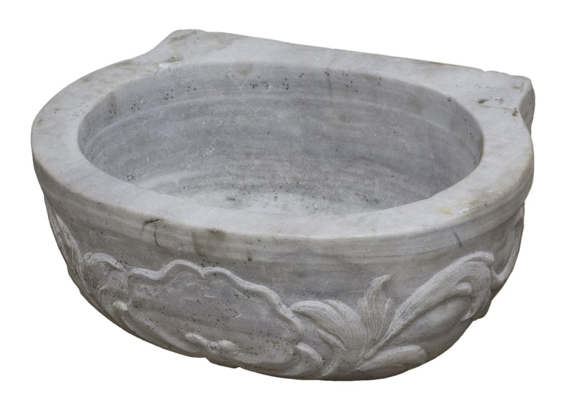 ARCHITECTURAL CARVED MARBLE GARDEN BASIN / WATER FONT: Architectural carved marble garden basin or font, hollowed bowl with foliated relief carving to exterior, unfinished back, slight chipping and staining commensurate with age and use, approx 8.25"h, 19
