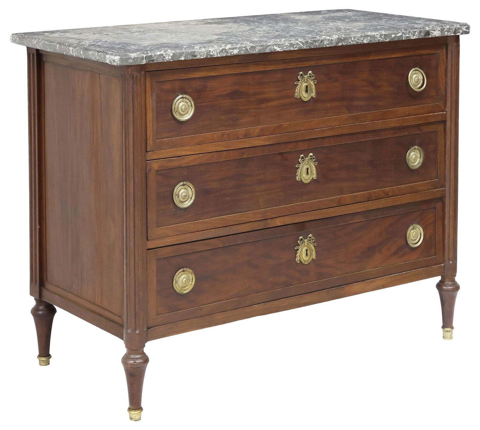 FRENCH LOUIS XVI STYLE MARBLE-TOP MAHOGANY COMMODE: French Louis XVI style mahogany commode, late 19th c., having shaped marble top, over three paneled drawers, flanked by fluted corner posts, rising on tapered legs, ending on brass cap feet, approx 35