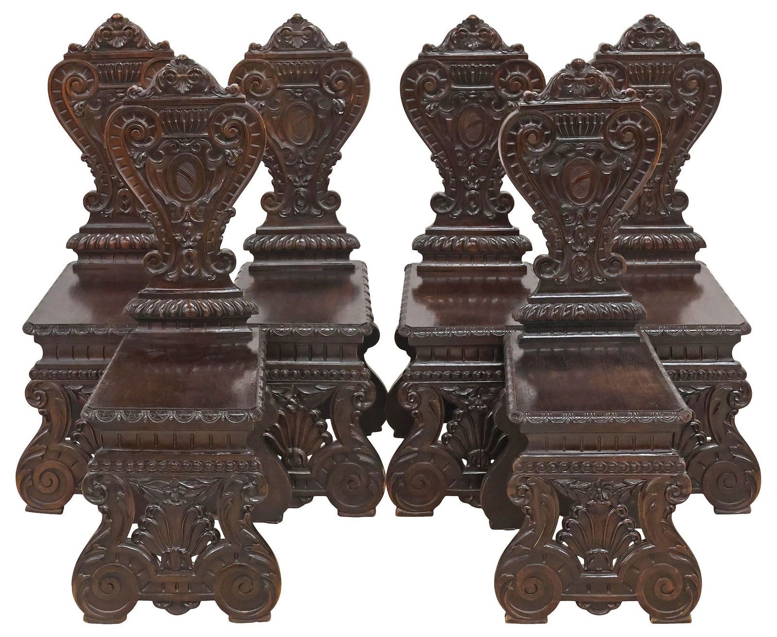 (6) ITALIAN RENAISSANCE REVIVAL CARVED WALNUT HALL CHAIRS: (lot of 6) Italian Renaissance Revival carved walnut hall chairs, late 19th c., having scrolled back with foliated crest and central shield, seat with lunette trim, rising on pierced supports with fol