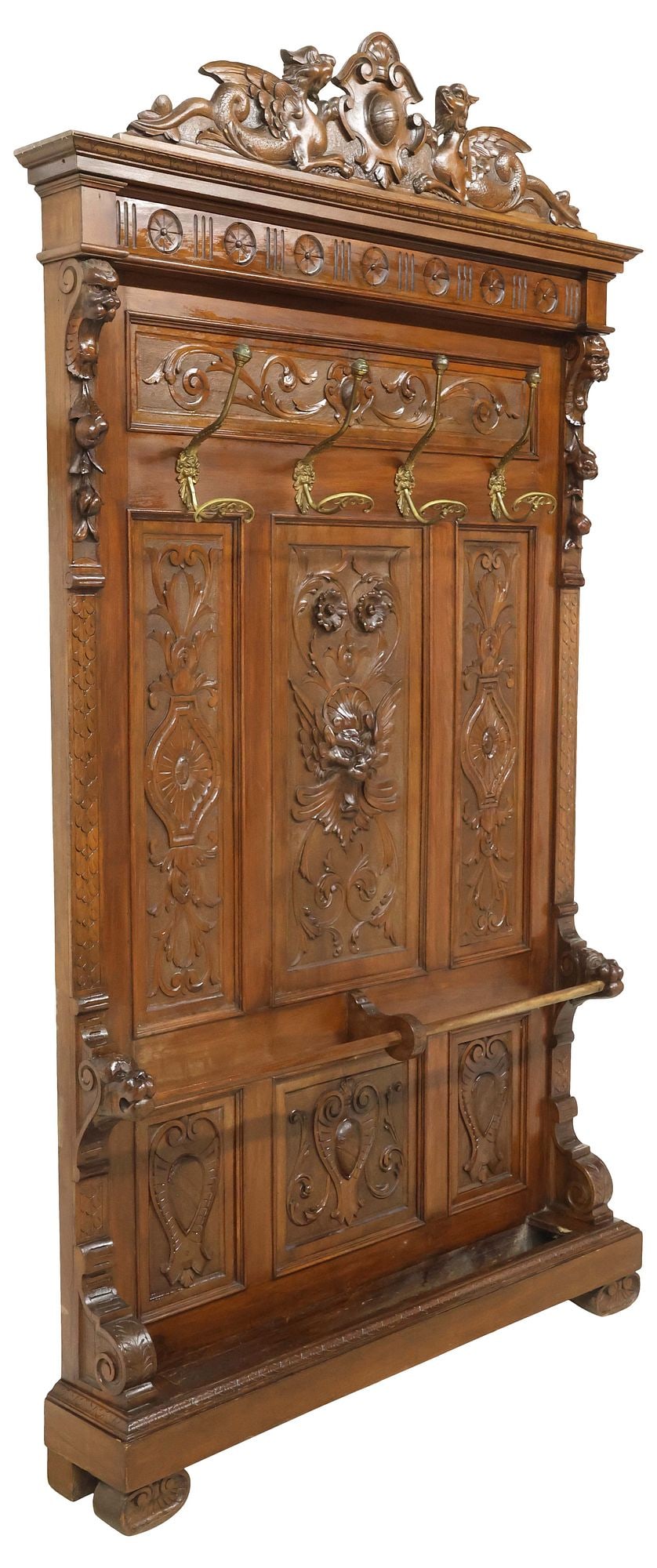 ITALIAN RENAISSANCE REVIVAL CARVED WALNUT HALL TREE, 101"H: Italian Renaissance Revival carved walnut hall tree, early 20th c., crest with pair of dragons flanking shield, above floral medallion frieze, paneled back with foliated scrollwork and central grotesq