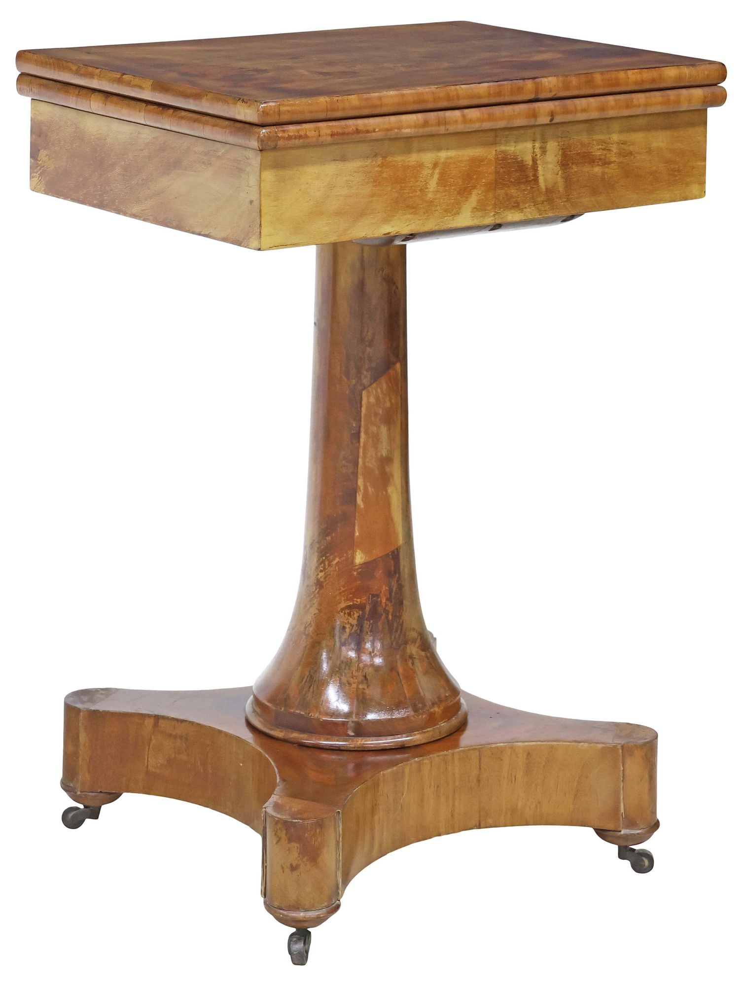 FRENCH EMPIRE STYLE MAHOGANY FLIP-TOP GAMES TABLE: French Empire style mahogany flip-top games table, early 20th c., having hinged rectangular top revealing inset felt playing surface, rising on tapering pedestal and quadripartite platform, ending on