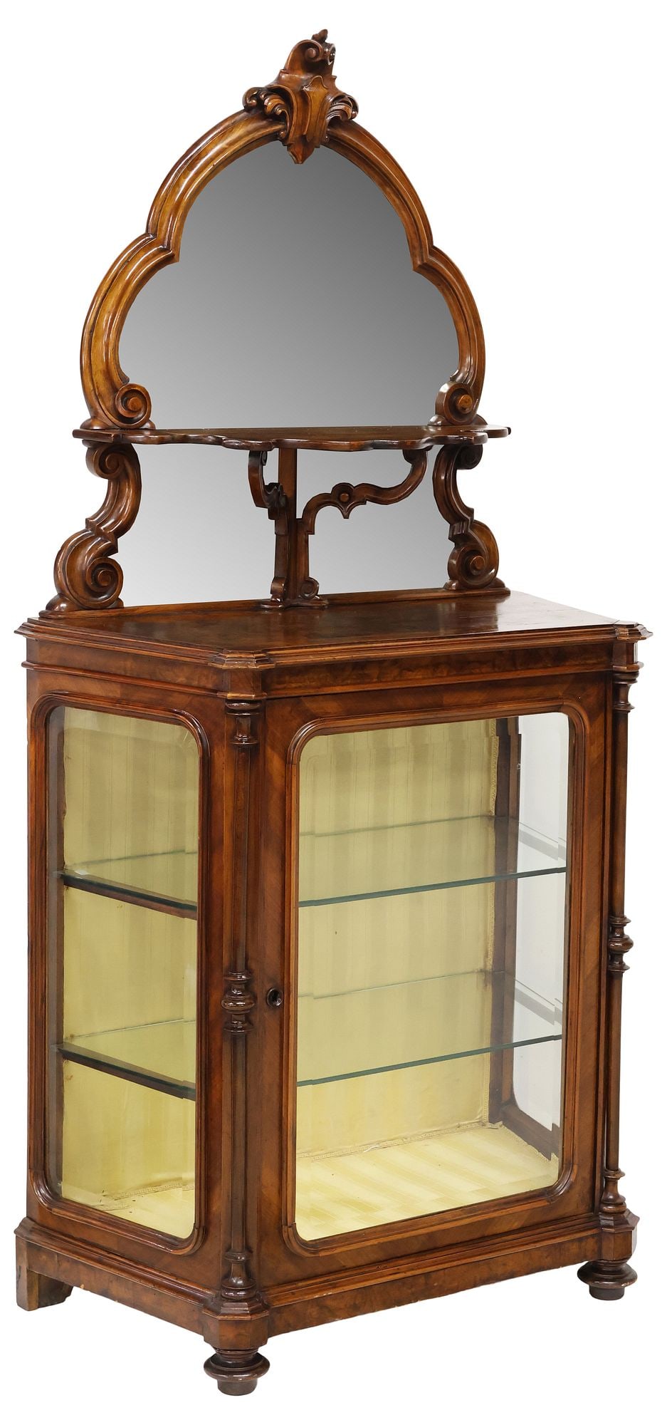 ITALIAN ROCOCO REVIVAL MIRRORED BURLED WALNUT DISPLAY CABINET: Italian Rococo Revival figured walnut display cabinet, late 19th c., a scrolled crest surmounting the beveled mirror plate and shaped upper shelf, the case with glazed cabinet door and side panels, re