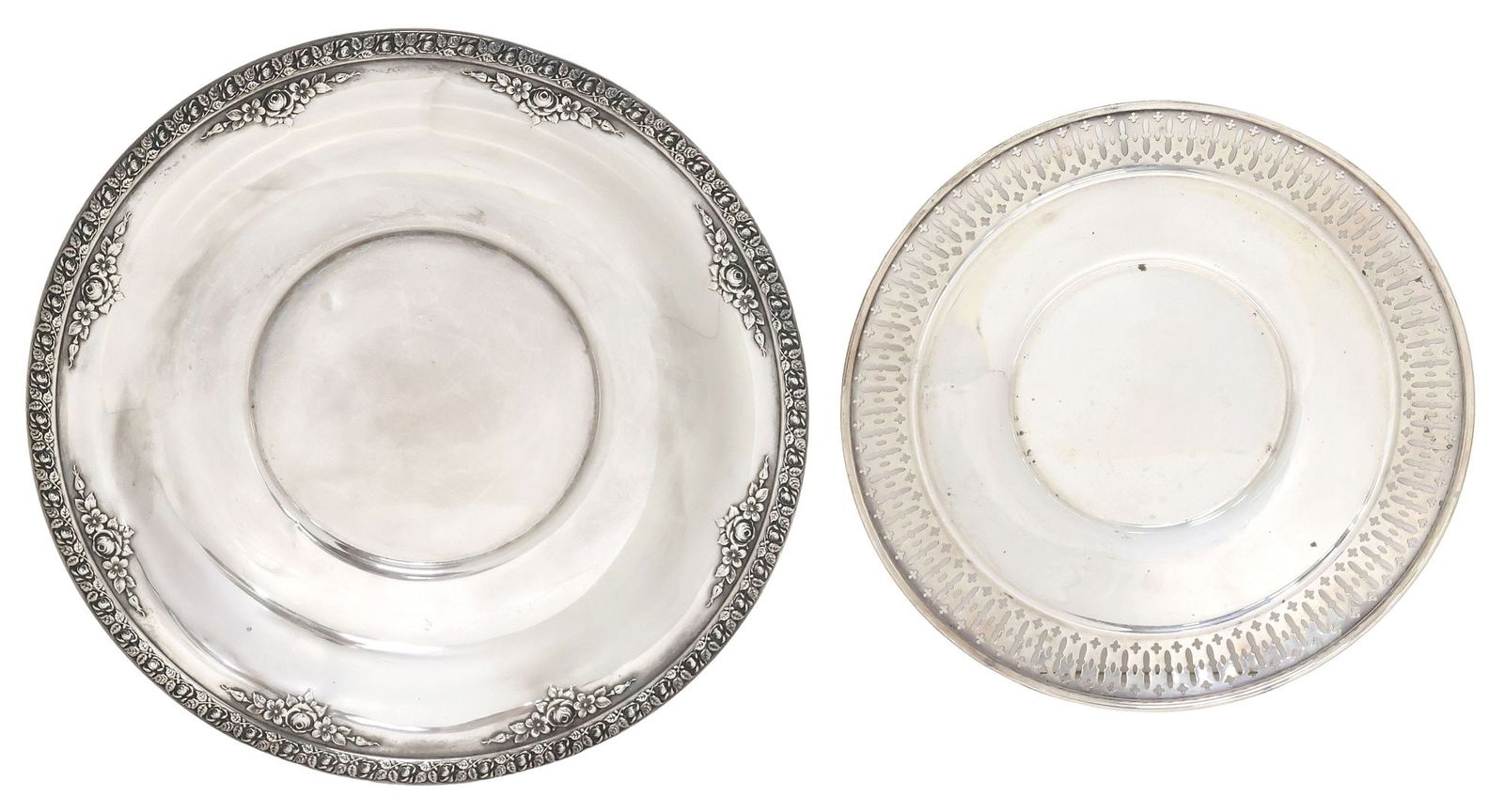 (2) AMERICAN STERLING SILVER REPOUSSE & RETICULATED SERVICE PLATES: (lot of 2) American sterling silver service plates, including: (1) Wallace, in the Normandie pattern, having repousse rim and flowers, full marks underfoot, dent to well, approx 9 7/8"diam; (1) servic