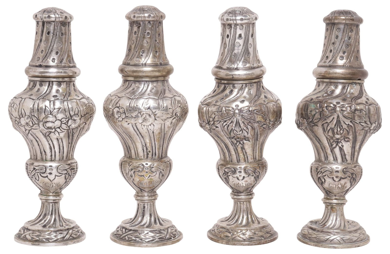 (4) GERMAN J.D. SCHLEISSNER & SOHNE HANAU SILVER CASTERS / SHAKERS: (lot of 4) German silver (content unknown) casters or shakers, J.D. Schleissner & Sohne, Hanau, each having turned-form body with ribbon motifs and draped floral swag, heart-shaped cartouche with trip