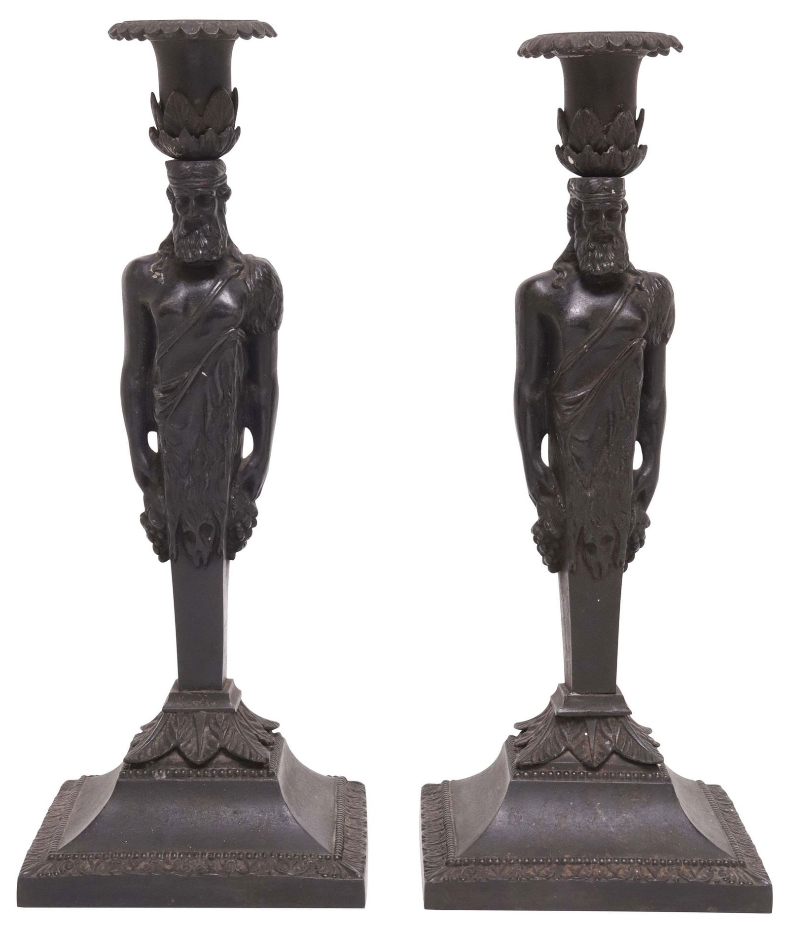 (2) EMPIRE STYLE CAST IRON FIGURAL BACCHUS 1-LIGHT CANDLESTICKS: (pair) Empire style cast iron figural candlesticks, each having a foliate candle cup, atop a Bacchus herm figure holding grape clusters, ending on tapered square base, illegible mark in an oval underf