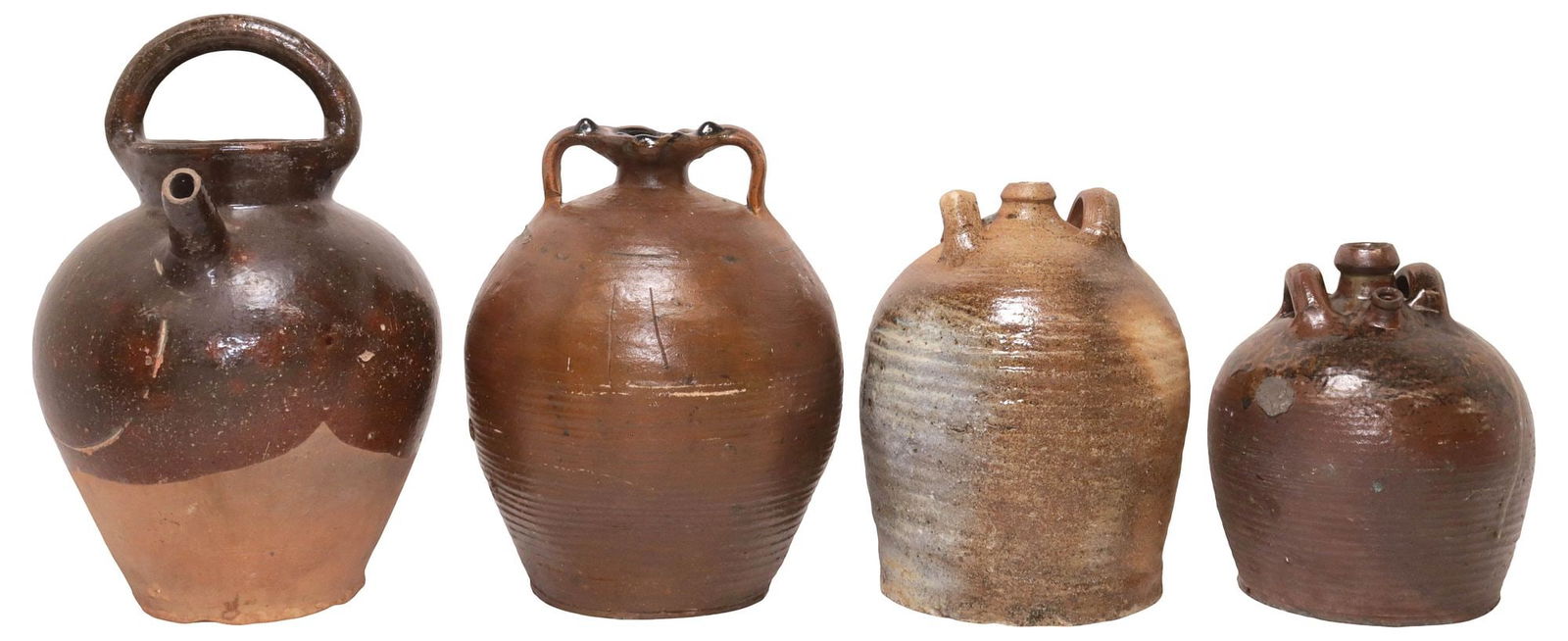 (4) FRENCH PROVINCIAL STONEWARE OIL JUGS & PITCHER: (lot of 4) French Provincial stoneware vessels, including: (3) oil jugs, with dual handles; (1) pitcher, with single handle and narrow spout, typical small chips throughout, largest: approx 14"h, 8.75
