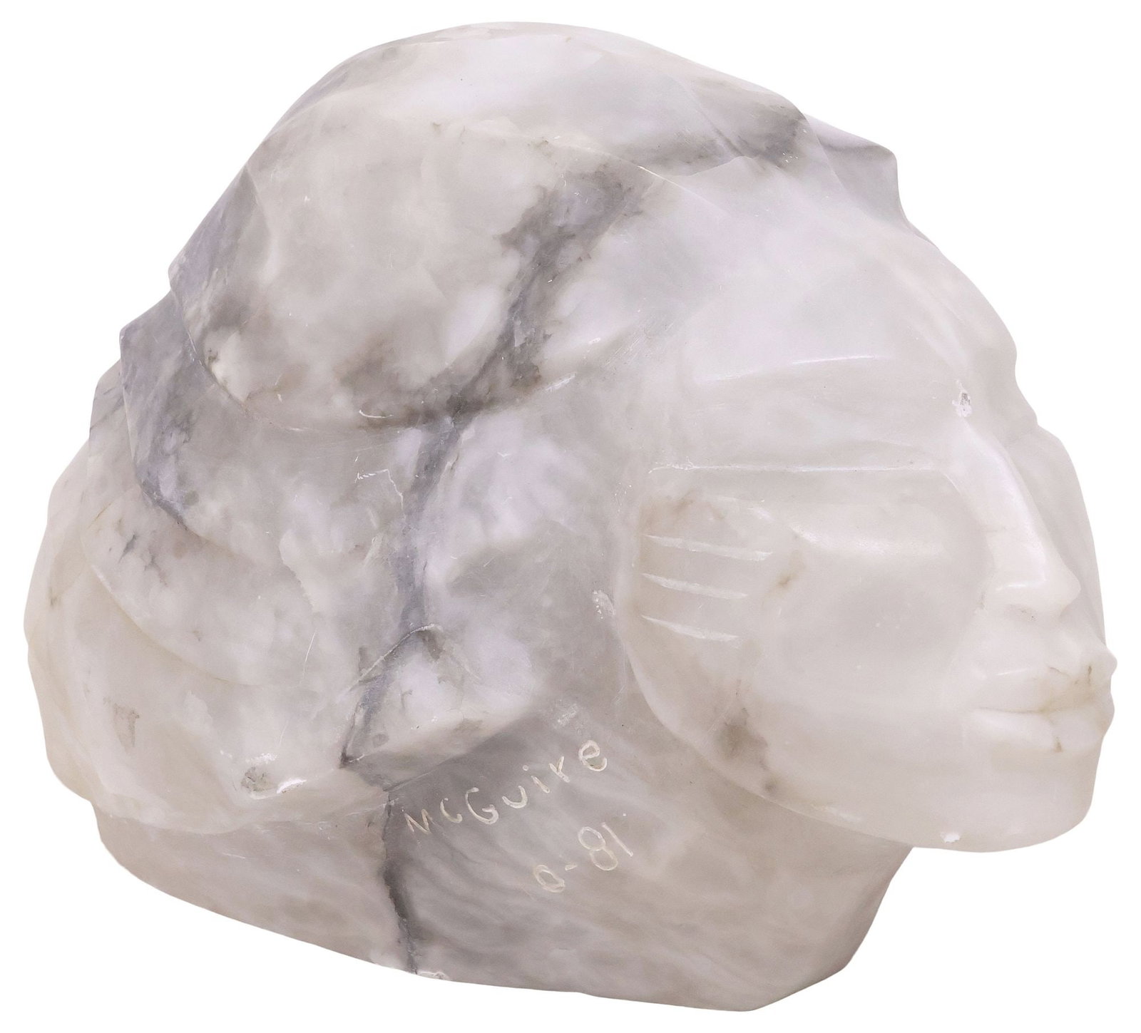 FRANK McGUIRE (B.1938) CARVED ALABASTER SCULPTURE OF A FEMALE HEAD: Carved alabaster sculpture, Head of a Woman, signed McGuire (Frank McGuire, American, b.1938), dated 10 (October) - [19]81, approx 13.5"h, 14"w, 19.5"d **Provenance: Dallas, Texas: