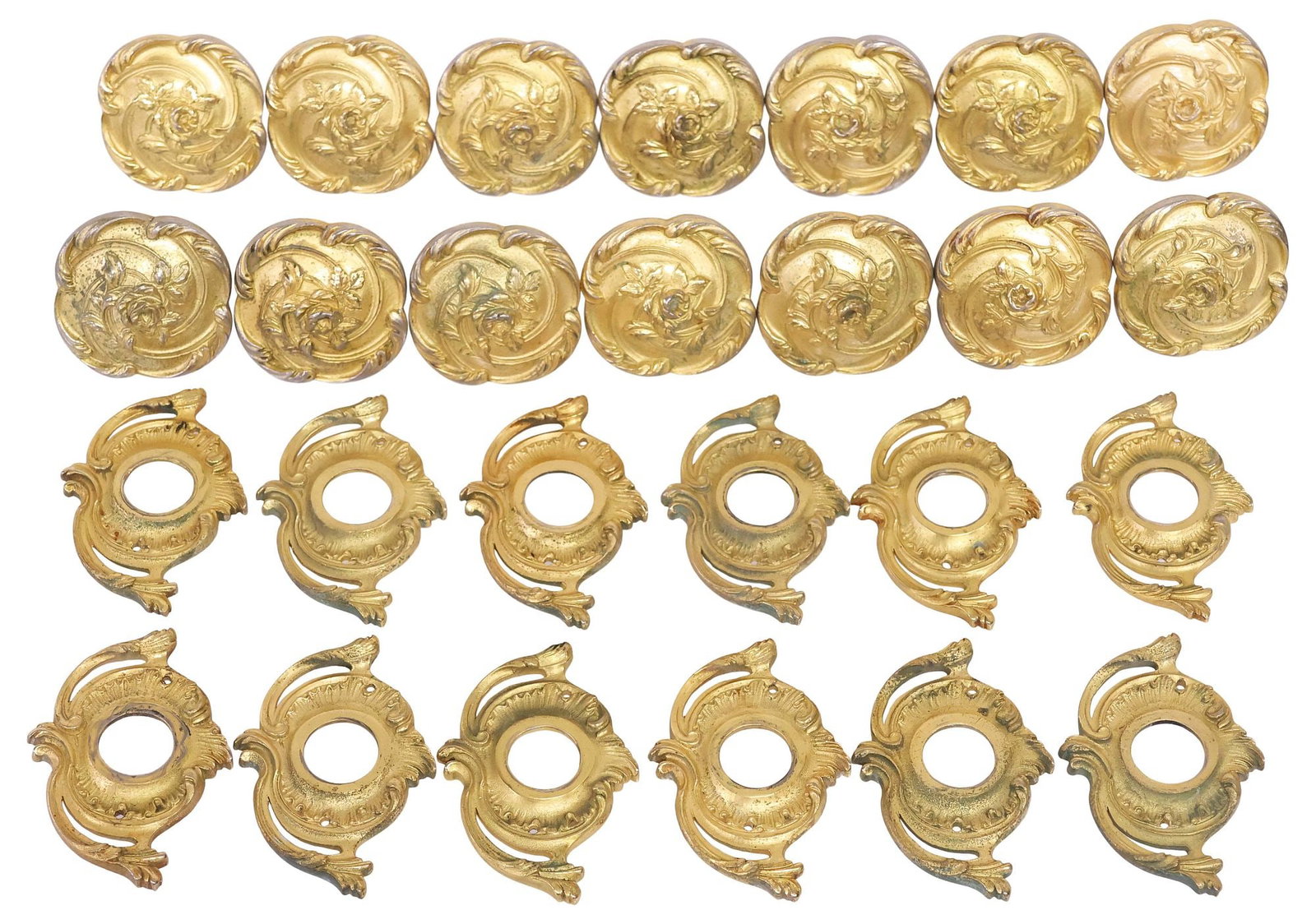 (LOT) DESIGNER SHERLE WAGNER GILT BRASS DOOR HARDWARE: KNOBS & PLATES: (lot) Designer gilt brass door hardware, Sherle Wagner International, 20th c., in the "French Rose" pattern, including: (14) knobs,(12) matched back plates, approx 4"l, 2.75"w, 2"d, 9.75lbs total **Pr