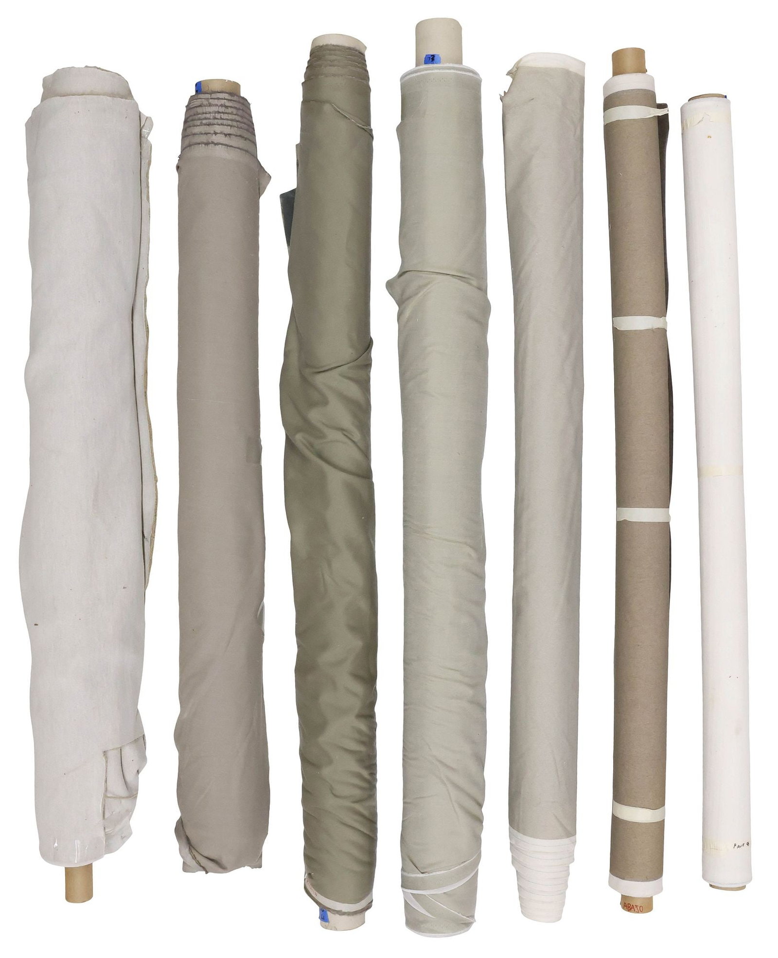 (7) COLLECTION OF NEUTRAL GREY AND BEIGE UPHOLSTERY FABRIC BOLTS: (lot of 7) Bolts of neutral tone upholstery fabric, various styles and makers, highlights include: (1) designed by Carnegie, in the "Pave" pattern, (1) in sleek grey velvet, (1) in chenille wool blend