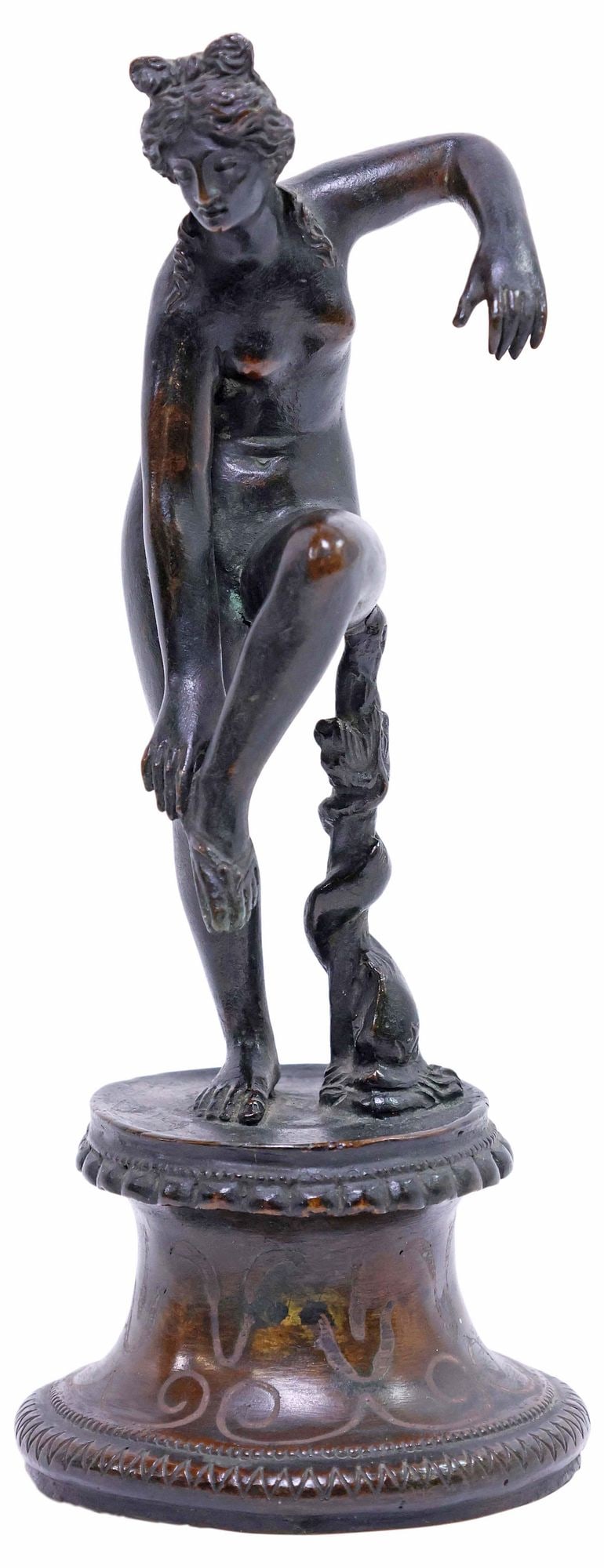 PATINATED METAL FIGURE AFTER THE ANTIQUE, APHRODITE ADJUSTING HER SANDAL: Grand Tour patinated metal sculpture, Aphrodite Adjusting her Sandal, after the Hellenistic-period antique, 19th c., on integral socle, approx 7 1/8"h, 2.75"w, 2.75"d, 1.5lbs