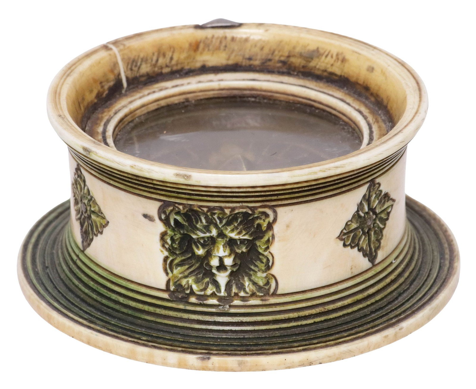 ANTIQUE SCRIMSHAW CASED DRY CARD COMPASS, 19TH C.: Scarce antique dry card compass, 19th c., in raised ornate circular scrimshaw case embellished with lion faces, the card with a fleur-de-lis north with the upper part marked "T