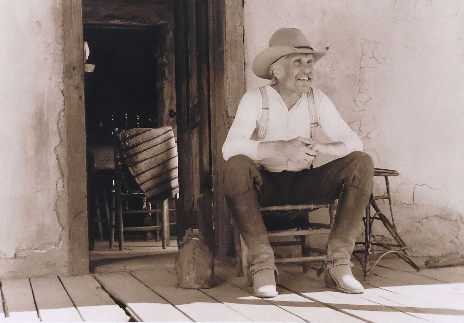 BILL WITTLIFF (1940-2019) DOUBLE-SIGNED TONED GELATIN SILVER PRINT, 'GUS ON THE FRONT PORCH' (1 of 5)