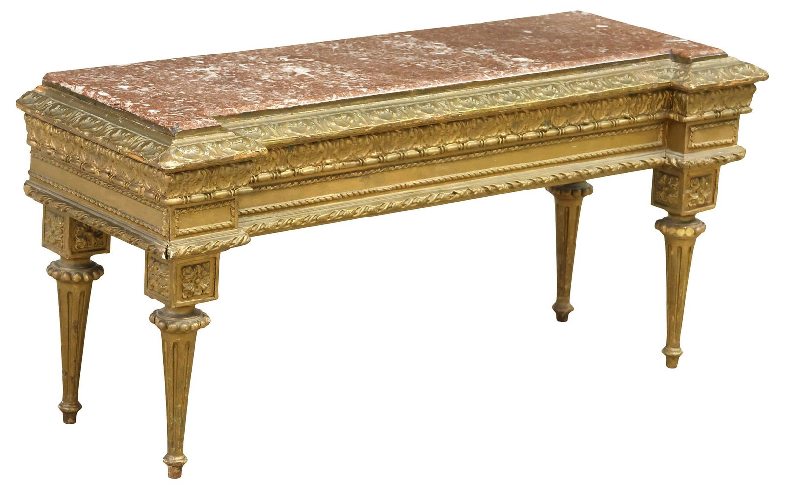 LOUIS XVI STYLE MARBLE-TOP GILT-PAINTED LOW CONSOLE TABLE: Louis XVI style gilt-painted low console table, early 20th c., inset rouge marble top, above running foliate ornamentation and ribbon twist trim, on tapering fluted legs, ending on blunt arrow feet, a