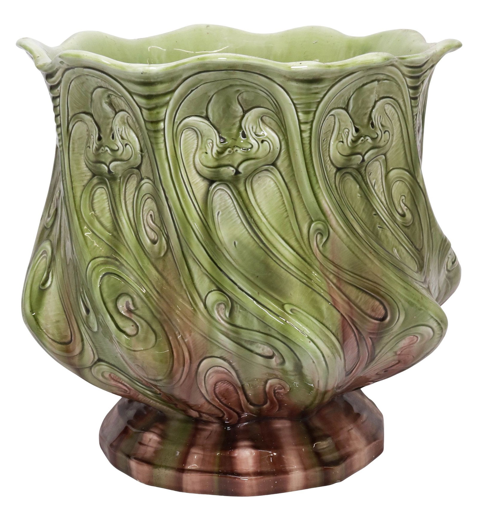 LARGE FRENCH ART NOUVEAU MAJOLICA PLANTER / JARDINIERE, 16"DIAM: Large French Art Nouveau tin-glazed earthenware planter/ jardiniere, early 20th c., having scalloped rim and relief-molded floral motifs, in an ombre green and plum glaze, on circular foot, unmarked,