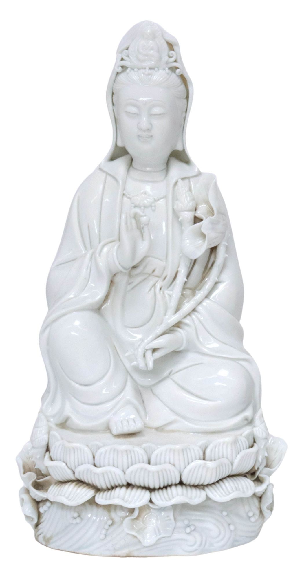 CHINESE 'BLANC DE CHINE' PORCELAIN CABINET FIGURE, SEATED GUANYIN: Chinese "blanc de chine" or Dehua porcelain cabinet figure, modeled as Guanyin, one hand in the Avalokitesvara (patience) mudra, the other with lotus flower, seated in lalitasana upon lotus