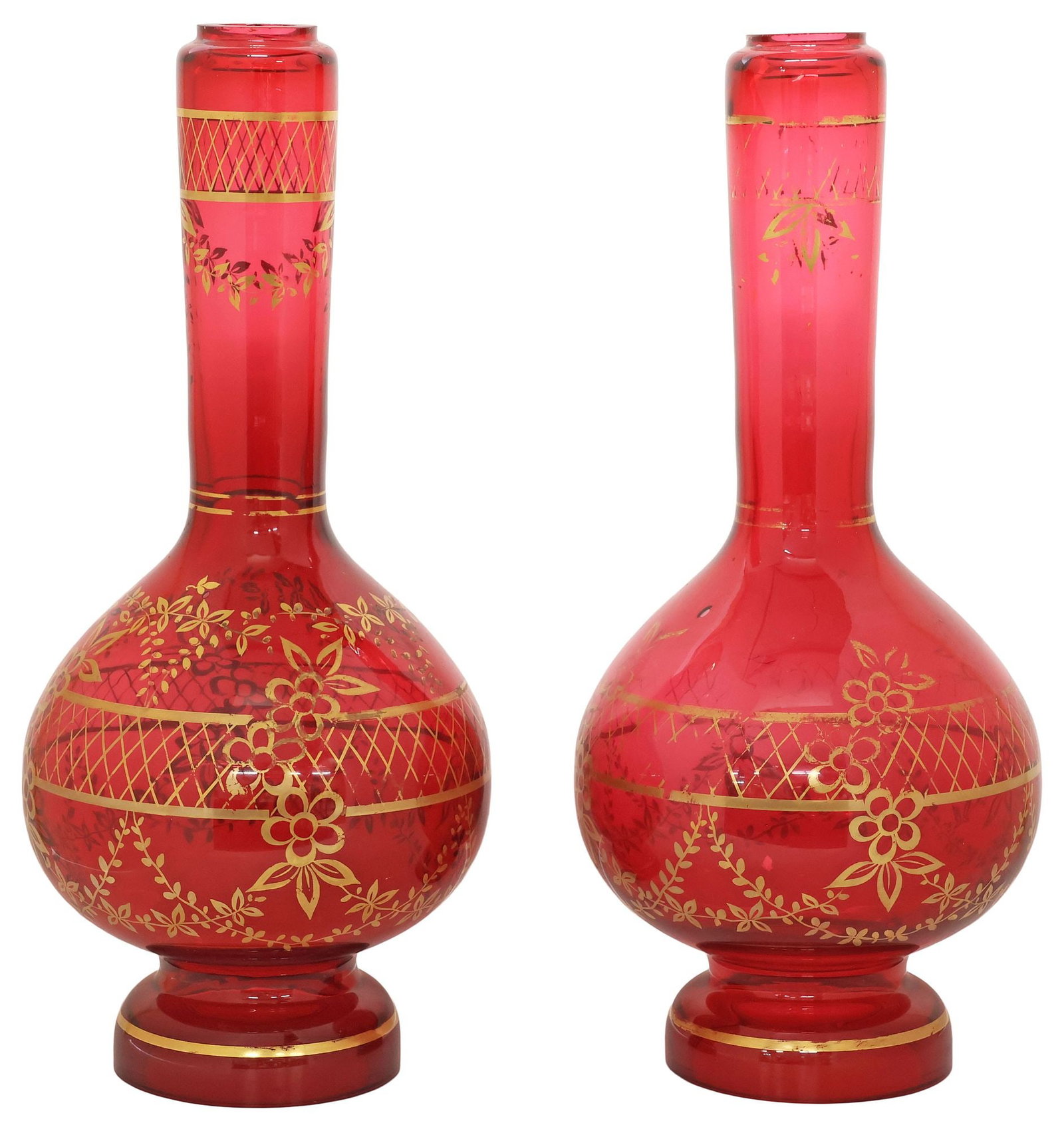(2) LARGE BOHEMIAN-STYLE PARCEL-GILT RED GLASS LAMP BASES, 16"H: (pair) Bohemian-style red glass bases, of bottle form, with parcel-gilt floral and crosshatched motifs, on circular open base, approx 16"h, 7"diam, 10.25lbs total **Provenance: Dallas, Texas: When